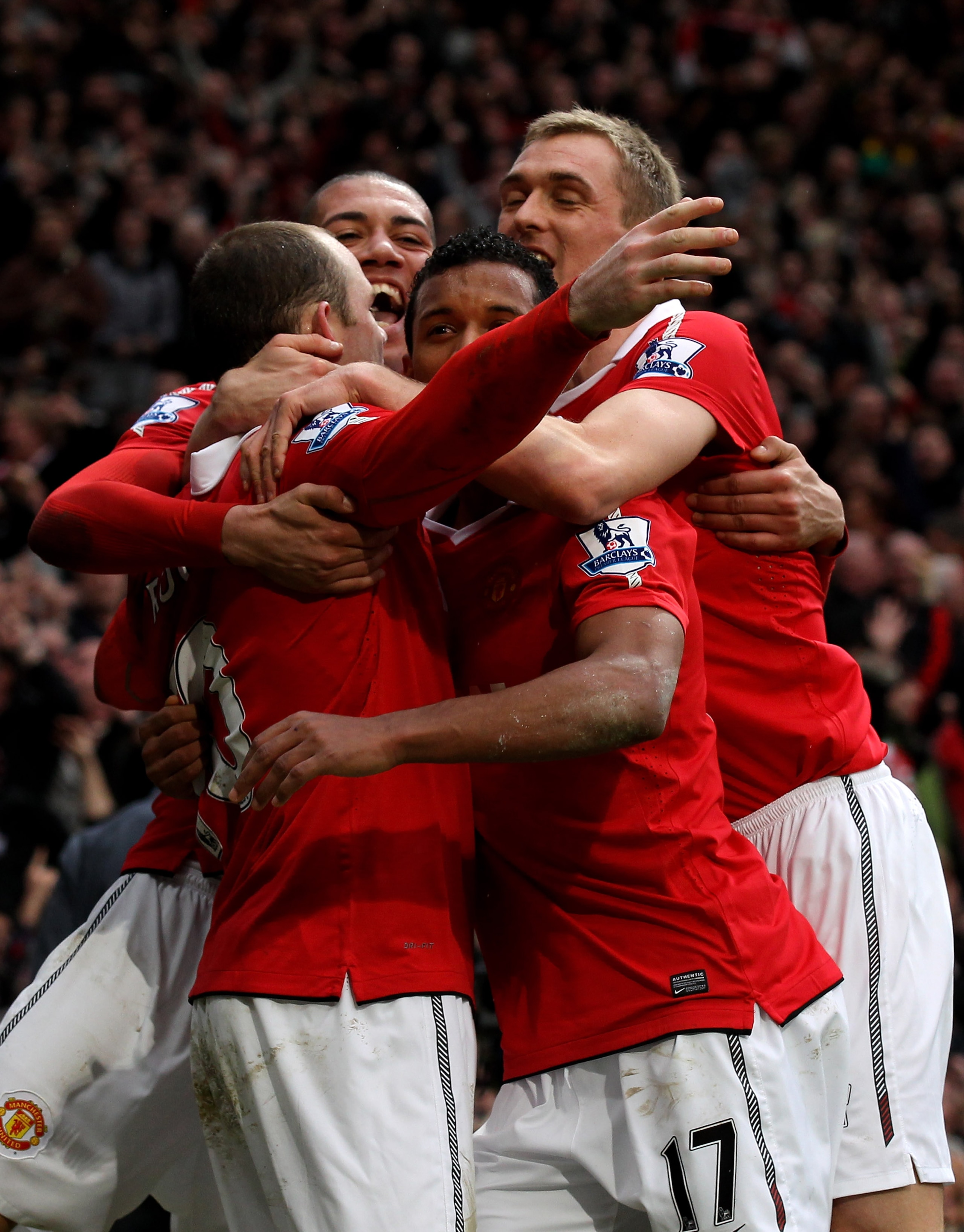 MANCHESTER, ENGLAND - FEBRUARY 12: Wayne Rooney (L) of Manchester United is mobbed by teammates after scoring during the Barclays Premier League match between Manchester United and Manchester City at Old Trafford on February 12, 2011 in Manchester, Engla MANCHESTER, ENGLAND - FEBRUARY 12: Wayne Rooney (L) of Manchester United is mobbed by teammates after scoring during the Barclays Premier League match between Manchester United and Manchester City at Old Trafford on February 12, 2011 in Manchester, Engla