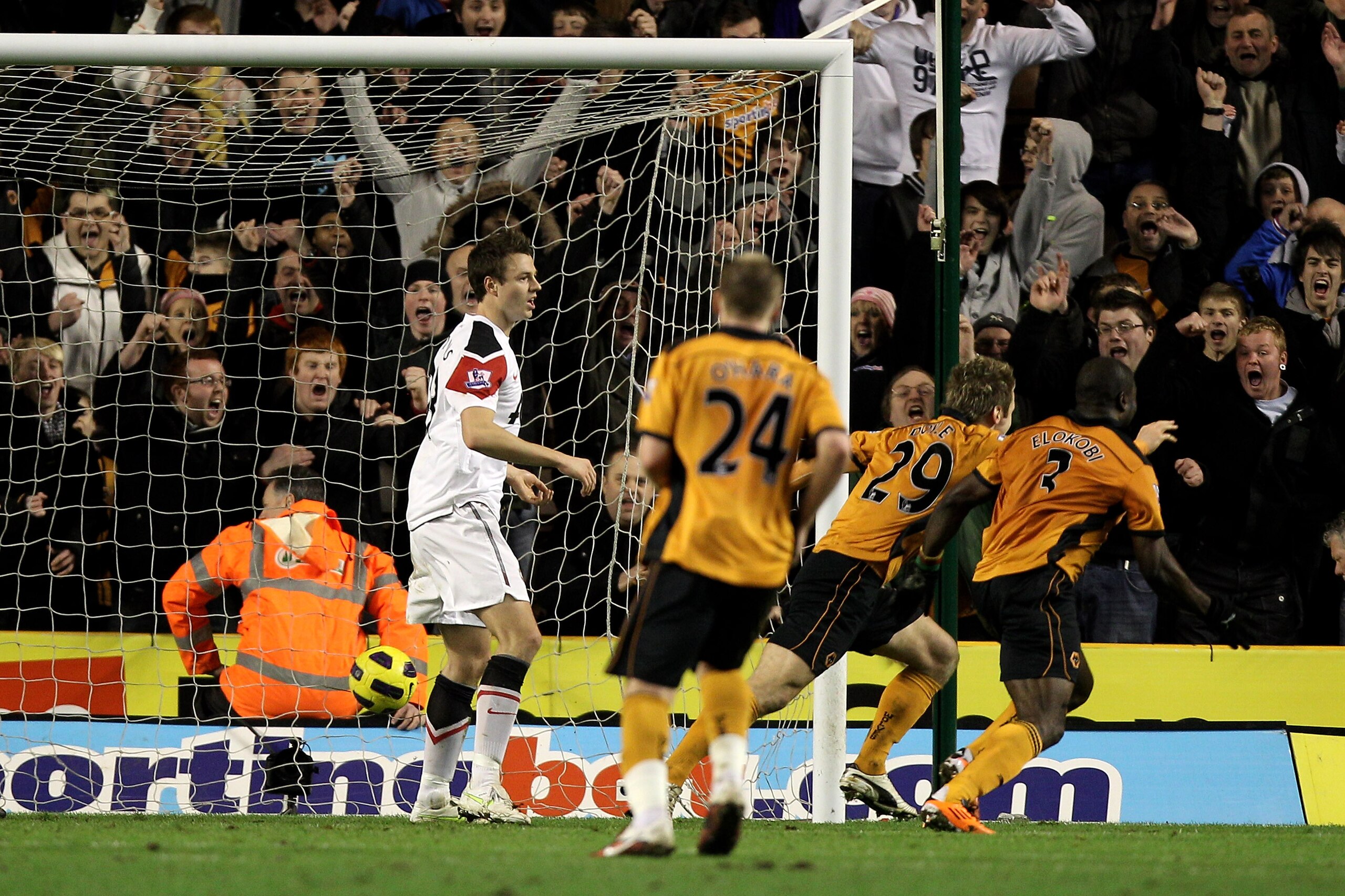 WOLVERHAMPTON, ENGLAND - FEBRUARY 05: Kevin Doyle of Wolverhampton (2R) celebrates scoring his teams second goal with teammate George Elokobi (R) during the Barclays Premier League match between Wolverhampton Wanderers and Manchester United at Molineux o WOLVERHAMPTON, ENGLAND - FEBRUARY 05: Kevin Doyle of Wolverhampton (2R) celebrates scoring his teams second goal with teammate George Elokobi (R) during the Barclays Premier League match between Wolverhampton Wanderers and Manchester United at Molineux o