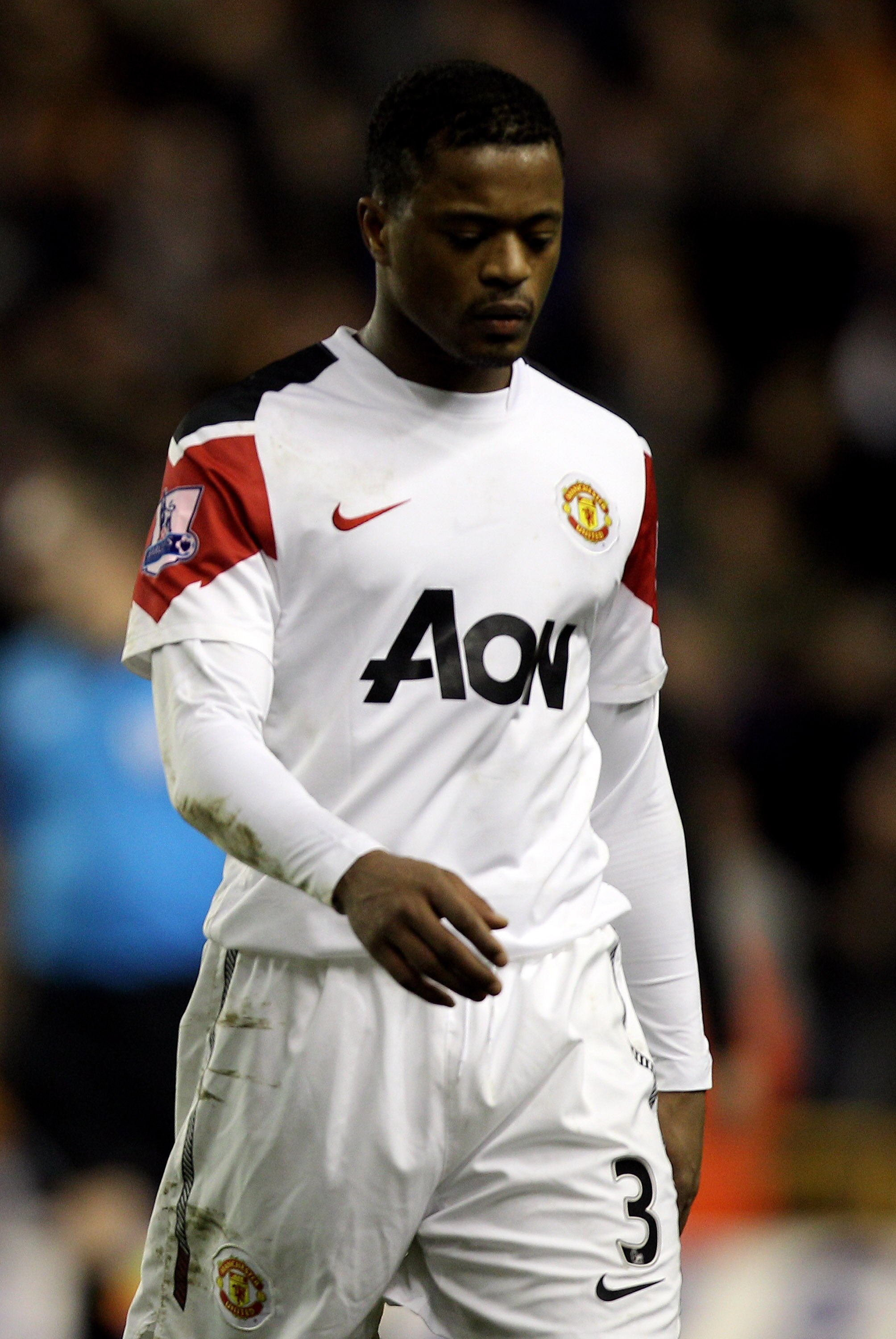 WOLVERHAMPTON, ENGLAND - FEBRUARY 05:  Patrice Evra leaves the pitch dejected after the Barclays Premier League match between Wolverhampton Wanderers and Manchester United at Molineux on February 5, 2011 in Wolverhampton, England.  (Photo by Michael Steel