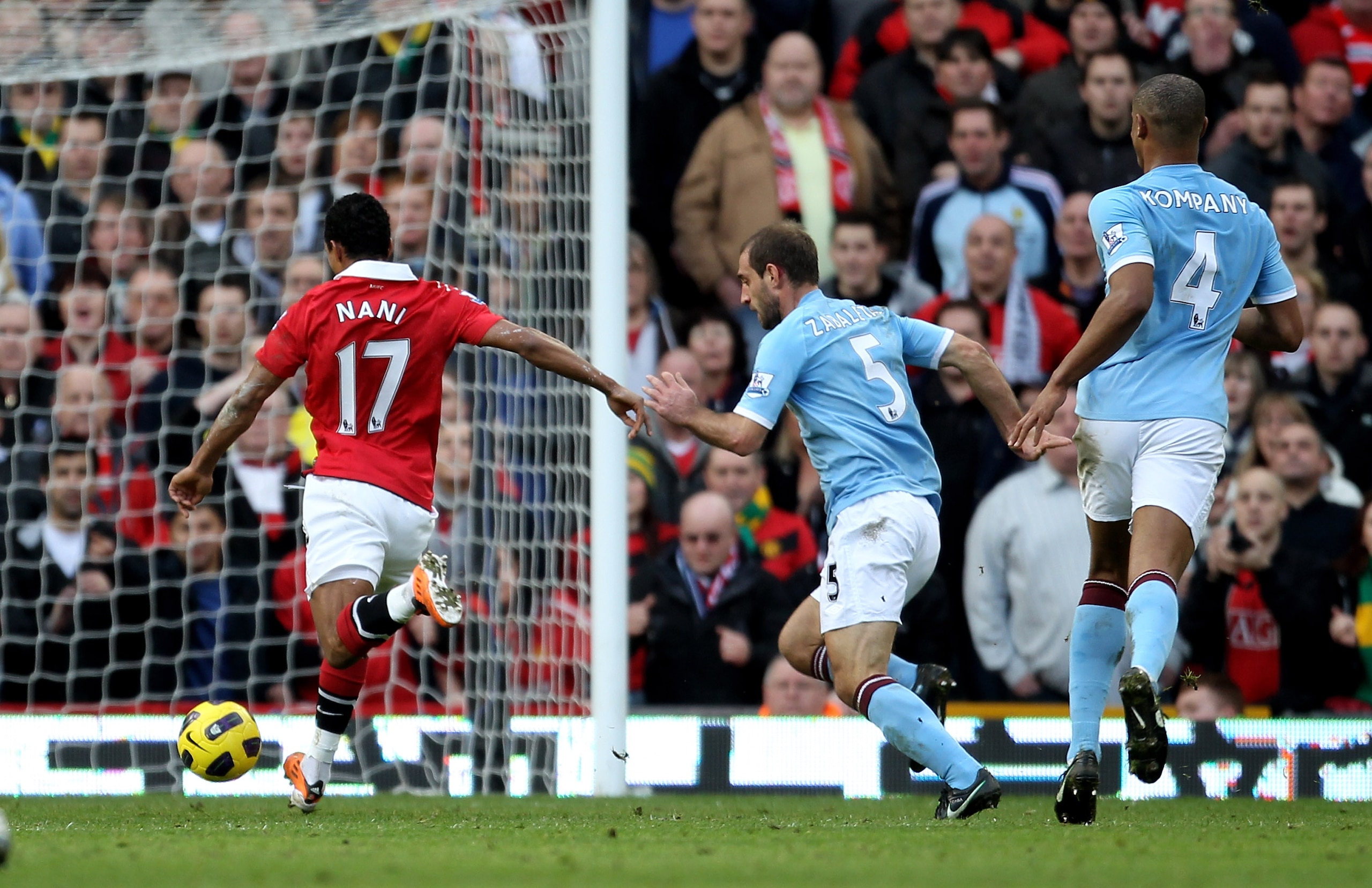 MANCHESTER, ENGLAND - FEBRUARY 12: Nani (L) of Manchester United shoots to score the opening goal during the Barclays Premier League match between Manchester United and Manchester City at Old Trafford on February 12, 2011 in Manchester, England. (Photo MANCHESTER, ENGLAND - FEBRUARY 12: Nani (L) of Manchester United shoots to score the opening goal during the Barclays Premier League match between Manchester United and Manchester City at Old Trafford on February 12, 2011 in Manchester, England. (Photo