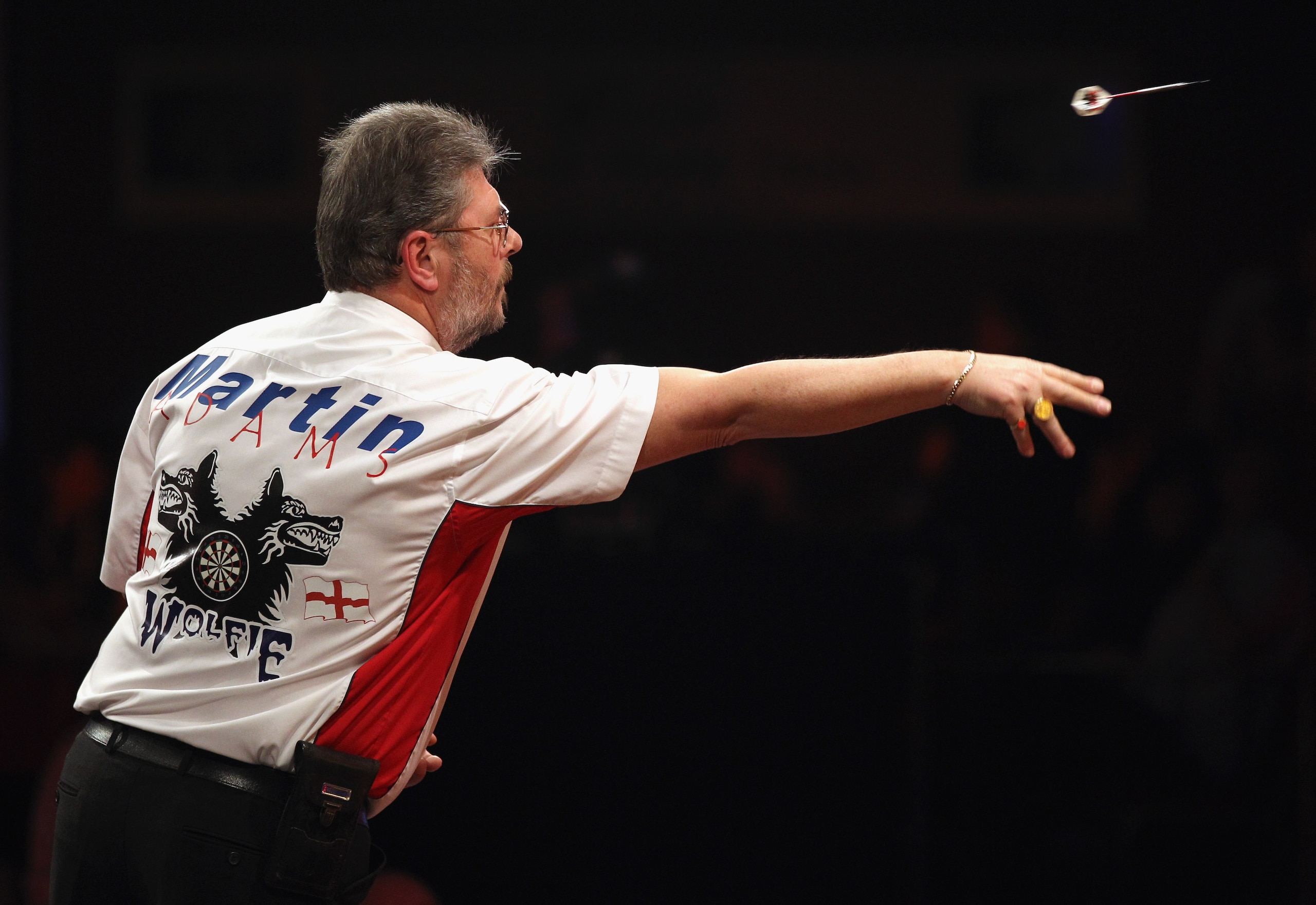 FRIMLEY, ENGLAND - JANUARY 09: Martin 'Wolfie' Adams of England plays in the BDO World Darts Championship final against Dean Winstanley of England at the Lakeside Country Club on January 9, 2011 in Frimley Green, England. The reigning champion Martin Ada FRIMLEY, ENGLAND - JANUARY 09: Martin 'Wolfie' Adams of England plays in the BDO World Darts Championship final against Dean Winstanley of England at the Lakeside Country Club on January 9, 2011 in Frimley Green, England. The reigning champion Martin Ada