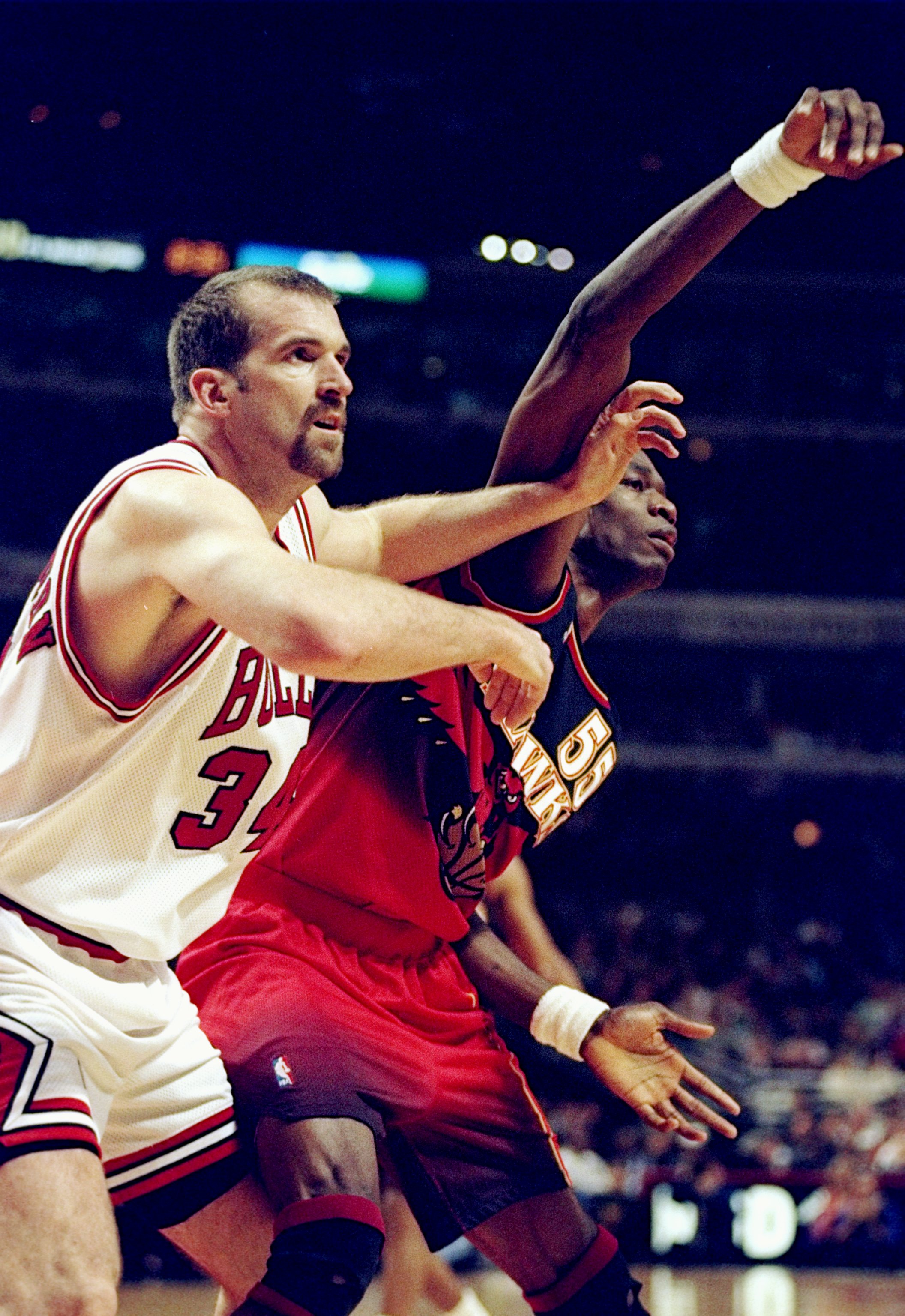 13 Feb 1998:  Center Dikembe Mutombo of the Atlanta Hawks (right) in action against center Bill Wennington of the Chicago Bulls during a game at the United Center in Chicago, Illinois.  The Bulls defeated the Hawks 112-110. Mandatory Credit: Jonathan Dani