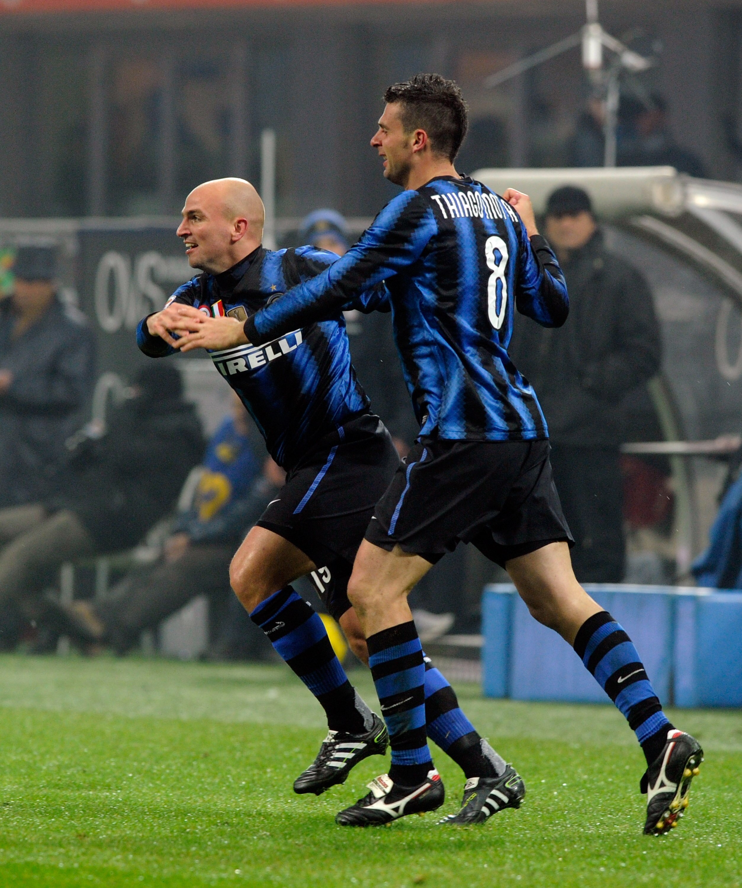 MILAN, ITALY - JANUARY 06:  Esteban Cambiasso (L) and Thiago Motta of FC Internazionale Milano celebrate scoring the third goal during the Serie A match between Inter and Napoli at Stadio Giuseppe Meazza on January 6, 2011 in Milan, Italy.  (Photo by Clau