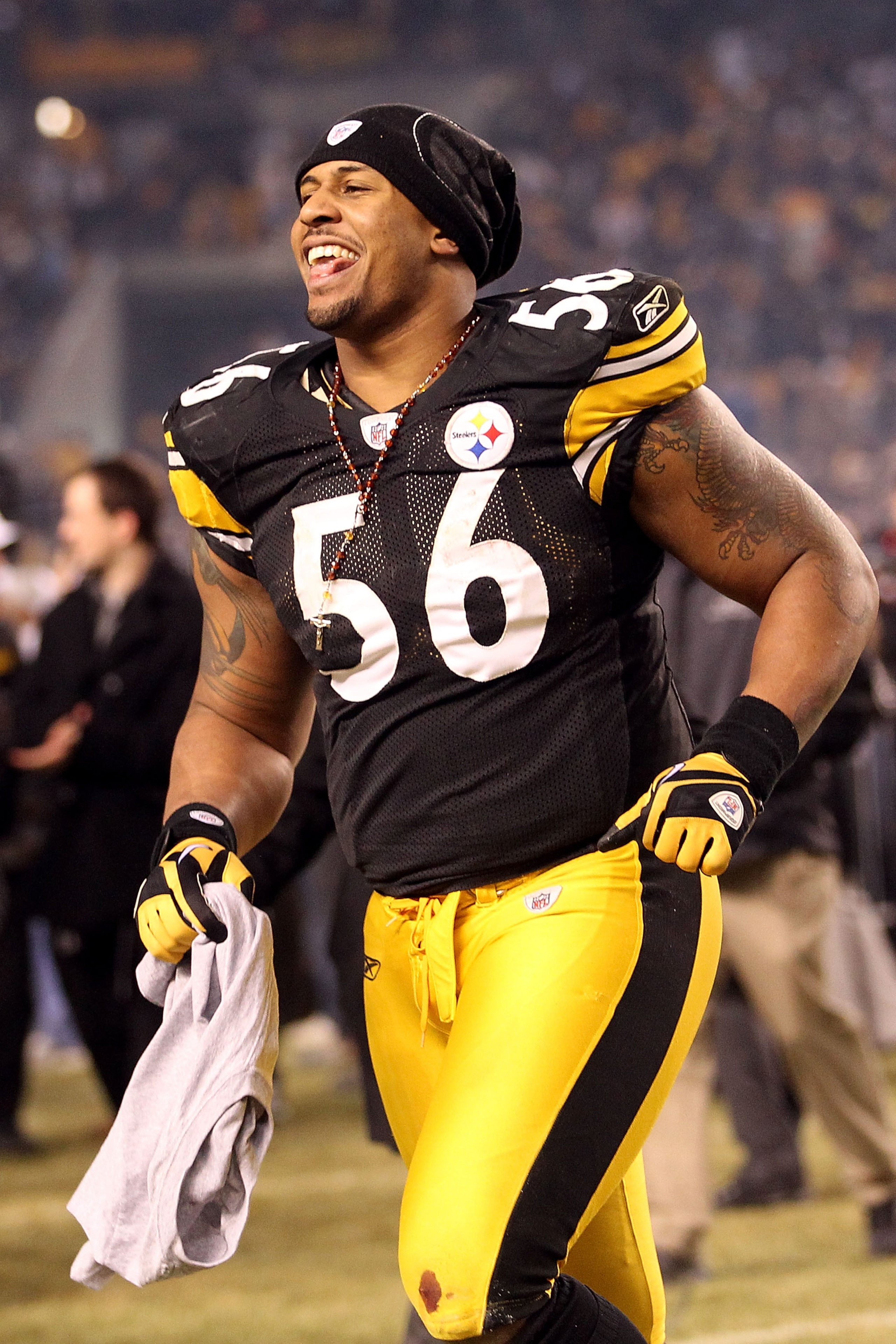 PITTSBURGH, PA - JANUARY 23:  LaMarr Woodley #56 of the Pittsburgh Steelers celebrates their 24 to 19 win over the New York Jets in the 2011 AFC Championship game at Heinz Field on January 23, 2011 in Pittsburgh, Pennsylvania.  (Photo by Ronald Martinez/G
