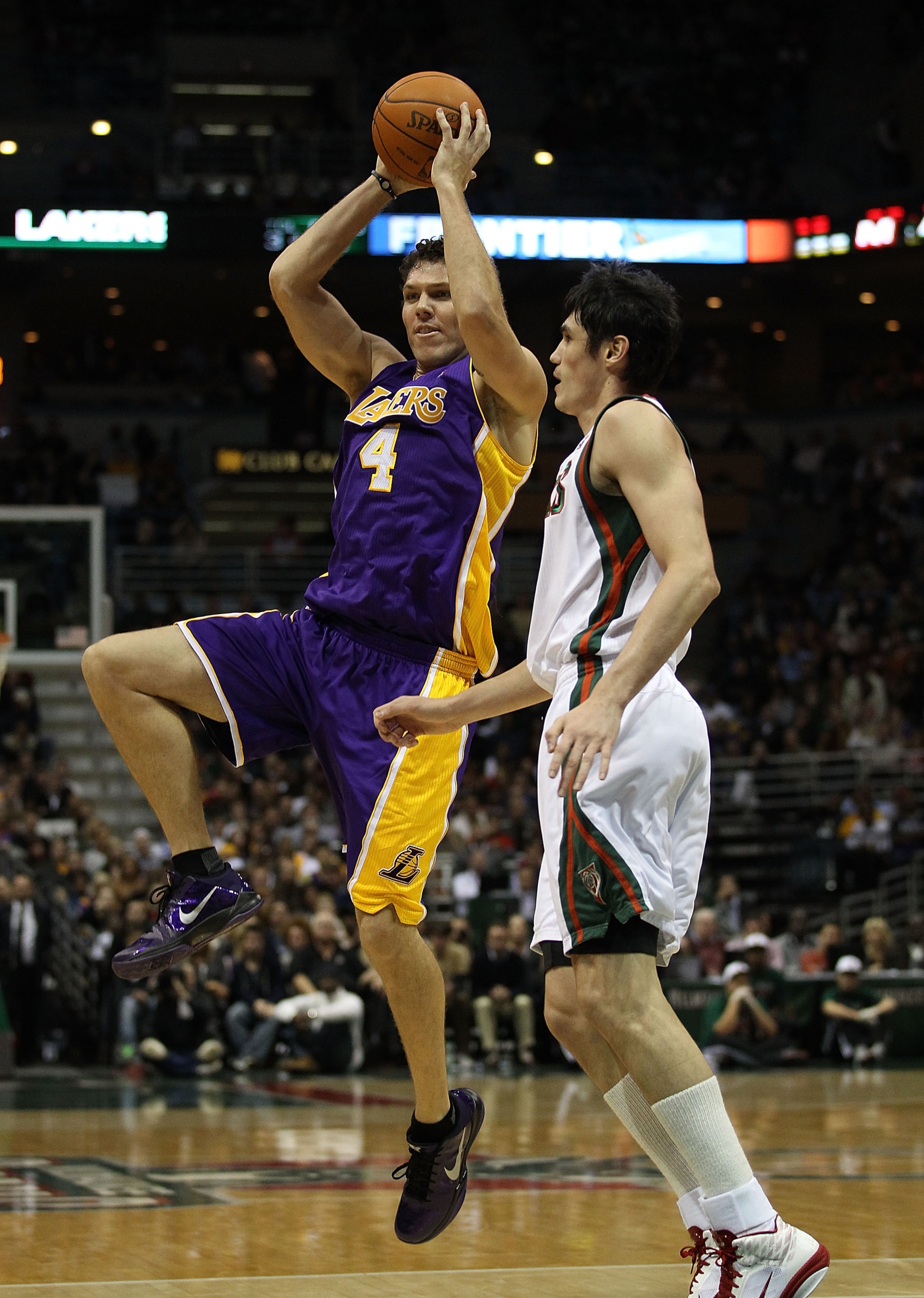 MILWAUKEE, WI - NOVEMBER 16: Luke Walton #4 of the Los Angeles Lakers passes the ball over Ersan Ilyasova #7 of the Milwaukee Bucks at the Bradley Center on November 16, 2010 in Milwaukee, Wisconsin. The Lakers defeated the Bucks 118-107. NOTE TO USER: Us