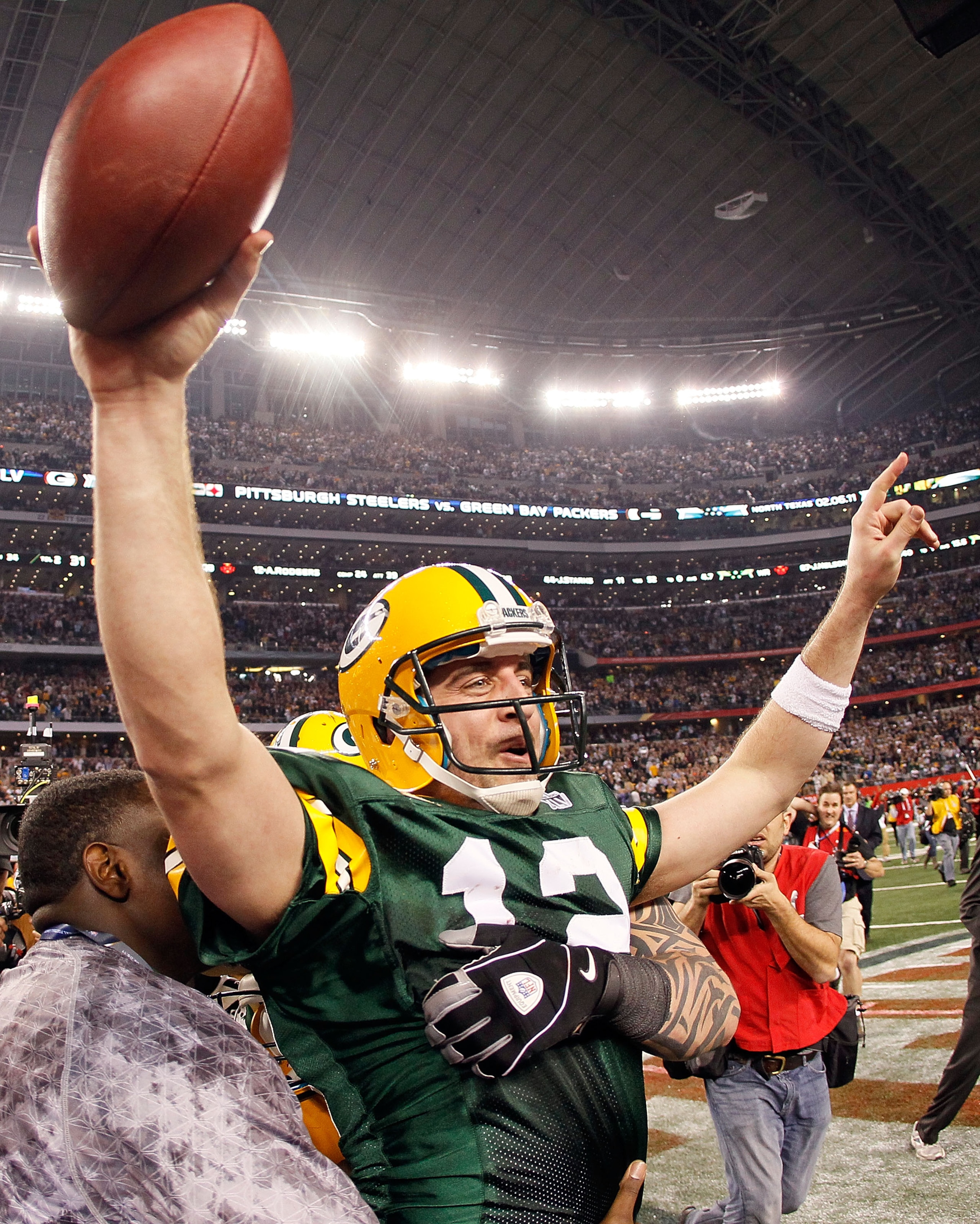 ARLINGTON, TX - FEBRUARY 06:  Aaron Rodgers #12 of the Green Bay Packers celebrates after winning Super Bowl XLV against the Pittsburgh Steelers at Cowboys Stadium on February 6, 2011 in Arlington, Texas.  (Photo by Kevin C. Cox/Getty Images)