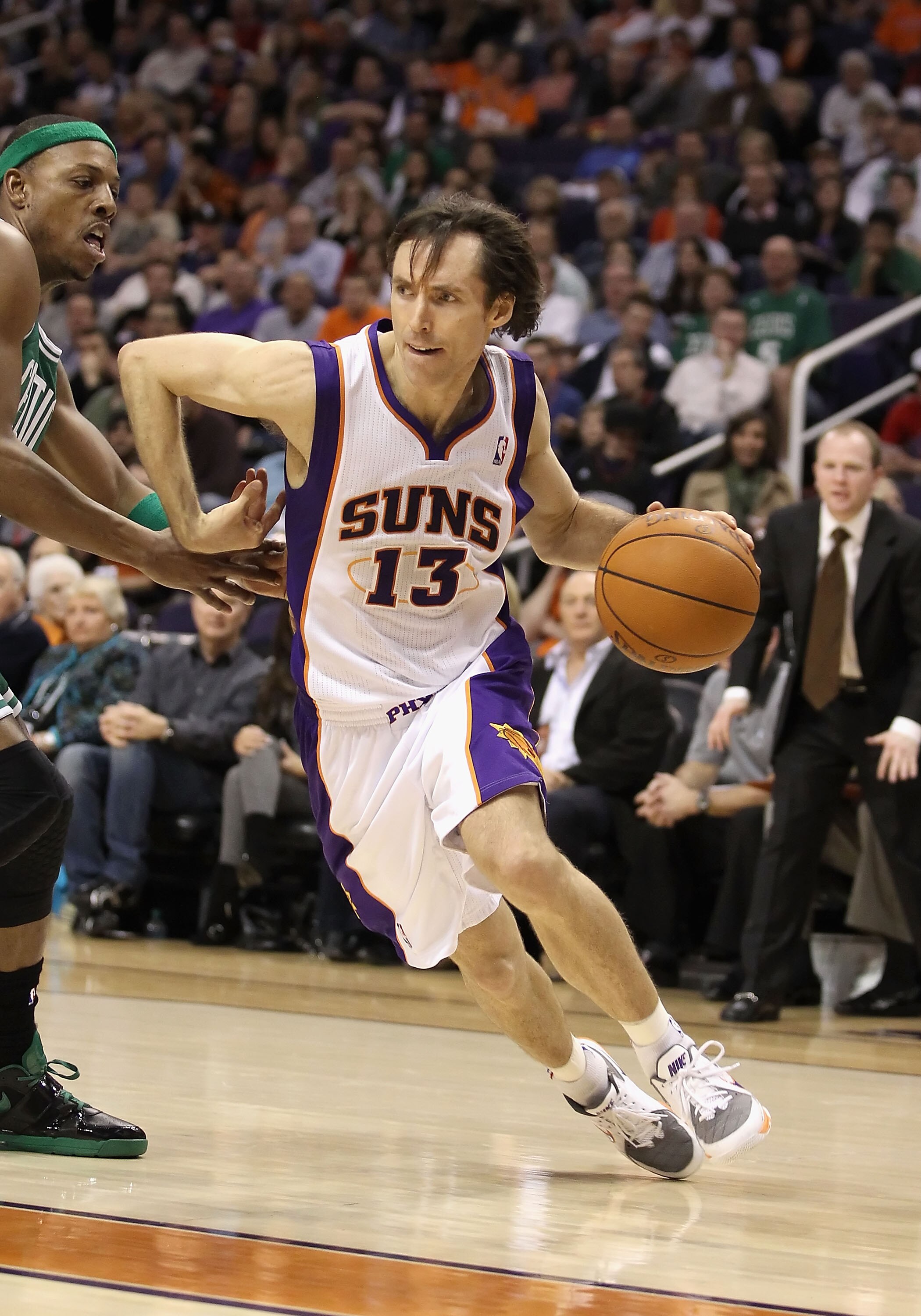 PHOENIX, AZ - JANUARY 28:  Steve Nash #13 of the Phoenix Suns drives the ball during the NBA game against the Boston Celtics at US Airways Center on January 28, 2011 in Phoenix, Arizona. The Suns defeated the Celtics 88-71. NOTE TO USER: User expressly ac
