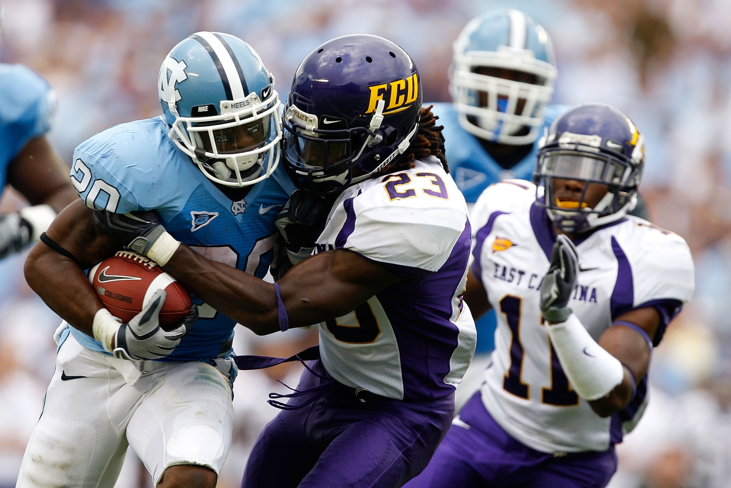 CHAPEL HILL, NC - SEPTEMBER 19:  Dekota Marshall #23 of the East Carolina Pirates tackles Shaun Draughn #20 of the North Carolina Tar Heels at Kenan Stadium on September 19, 2009 in Chapel Hill, North Carolina.  (Photo by Streeter Lecka/Getty Images)