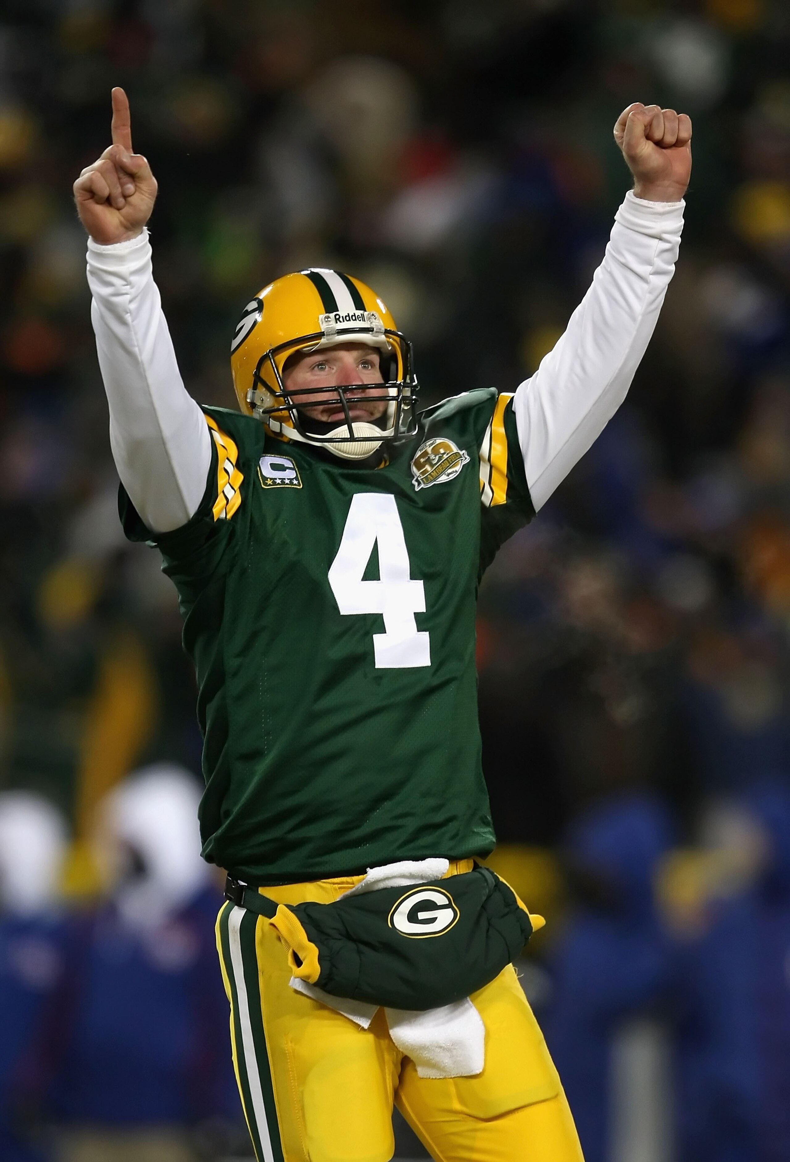 GREEN BAY, WI - JANUARY 20:  Quarterback Brett Favre #4 of the Green Bay Packers celebrates after throwing a 12 yard touchdown recption during the third quarter of the NFC championship game against the New York Giants on January 20, 2008 at Lambeau Field