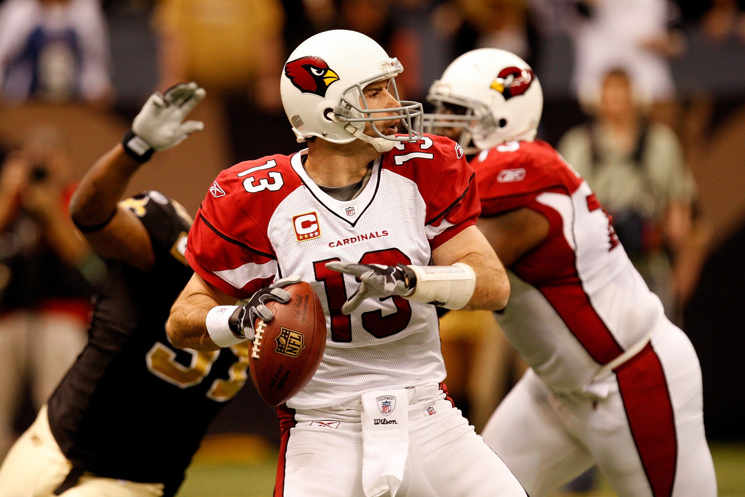 NEW ORLEANS - JANUARY 16:  Kurt Warner #13 of the Arizona Cardinals throws a pass against the New Orleans Saints during the NFC Divisional Playoff Game at Louisana Superdome on January 16, 2010 in New Orleans, Louisiana.  (Photo by Ronald Martinez/Getty I