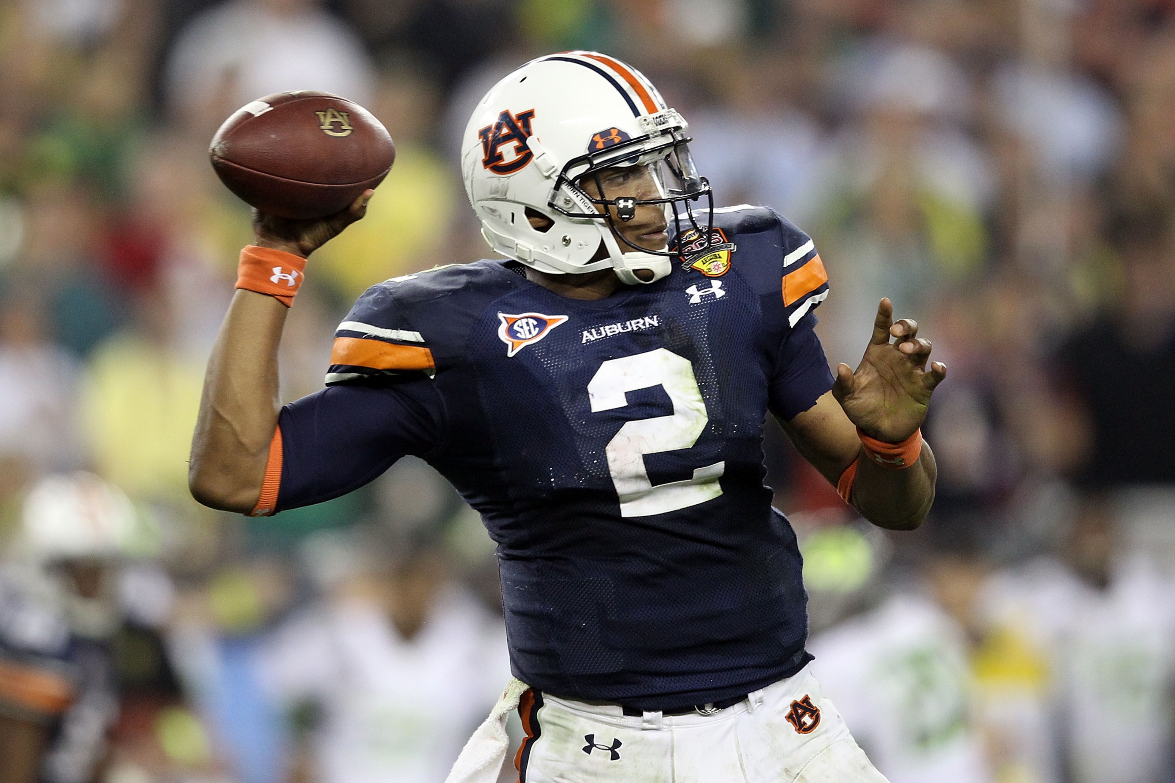 GLENDALE, AZ - JANUARY 10: Quarterback Cameron Newton #2 of the Auburn Tigers throws the ball in the third quarter against the Oregon Ducks during the Tostitos BCS National Championship Game at University of Phoenix Stadium on January 10, 2011 in Glendal GLENDALE, AZ - JANUARY 10: Quarterback Cameron Newton #2 of the Auburn Tigers throws the ball in the third quarter against the Oregon Ducks during the Tostitos BCS National Championship Game at University of Phoenix Stadium on January 10, 2011 in Glendal