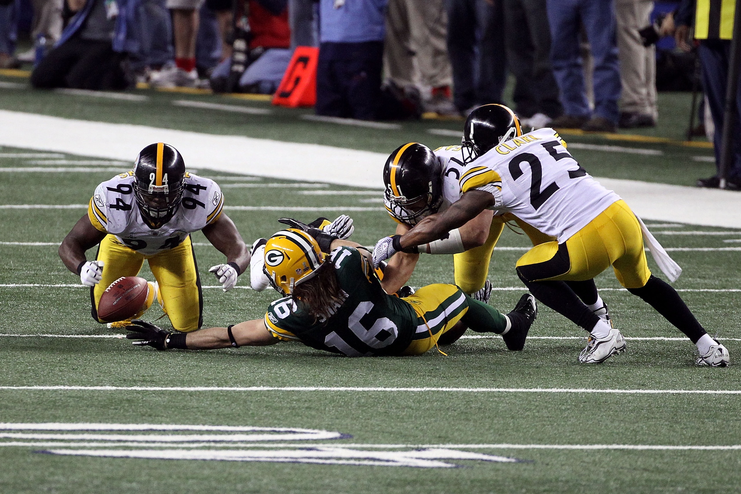 ARLINGTON, TX - FEBRUARY 06: Brett Swain #16 of the Green Bay Packers has a pass broken up by Ryan Clark #25, James Farrior #51 and Lawrence Timmons #94 of the Pittsburgh Steelers during Super Bowl XLV at Cowboys Stadium on February 6, 2011 in Arlington,