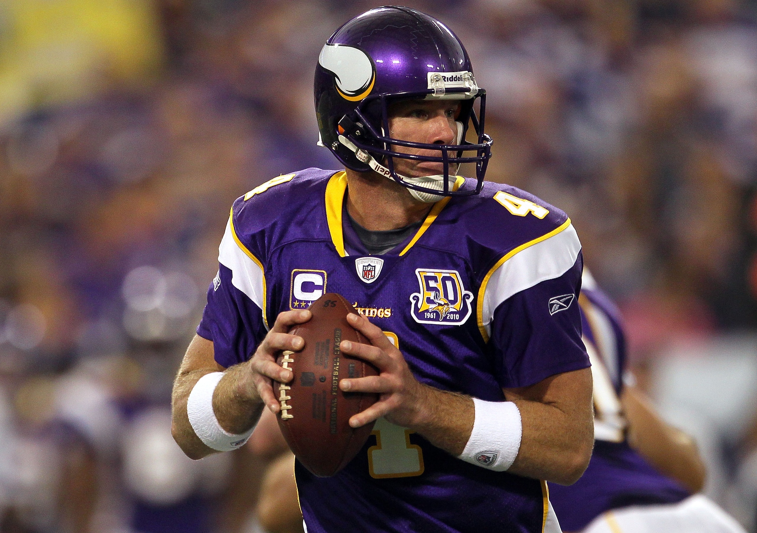 MINNEAPOLIS - SEPTEMBER 26:  Quarterback Brett Favre #4 of the Minnesota Vikings drops back to pass against the Detroit Lions during the game at Hubert H. Humphrey Metrodome on September 26, 2010 in Minneapolis, Minnesota.  (Photo by Jeff Gross/Getty Imag