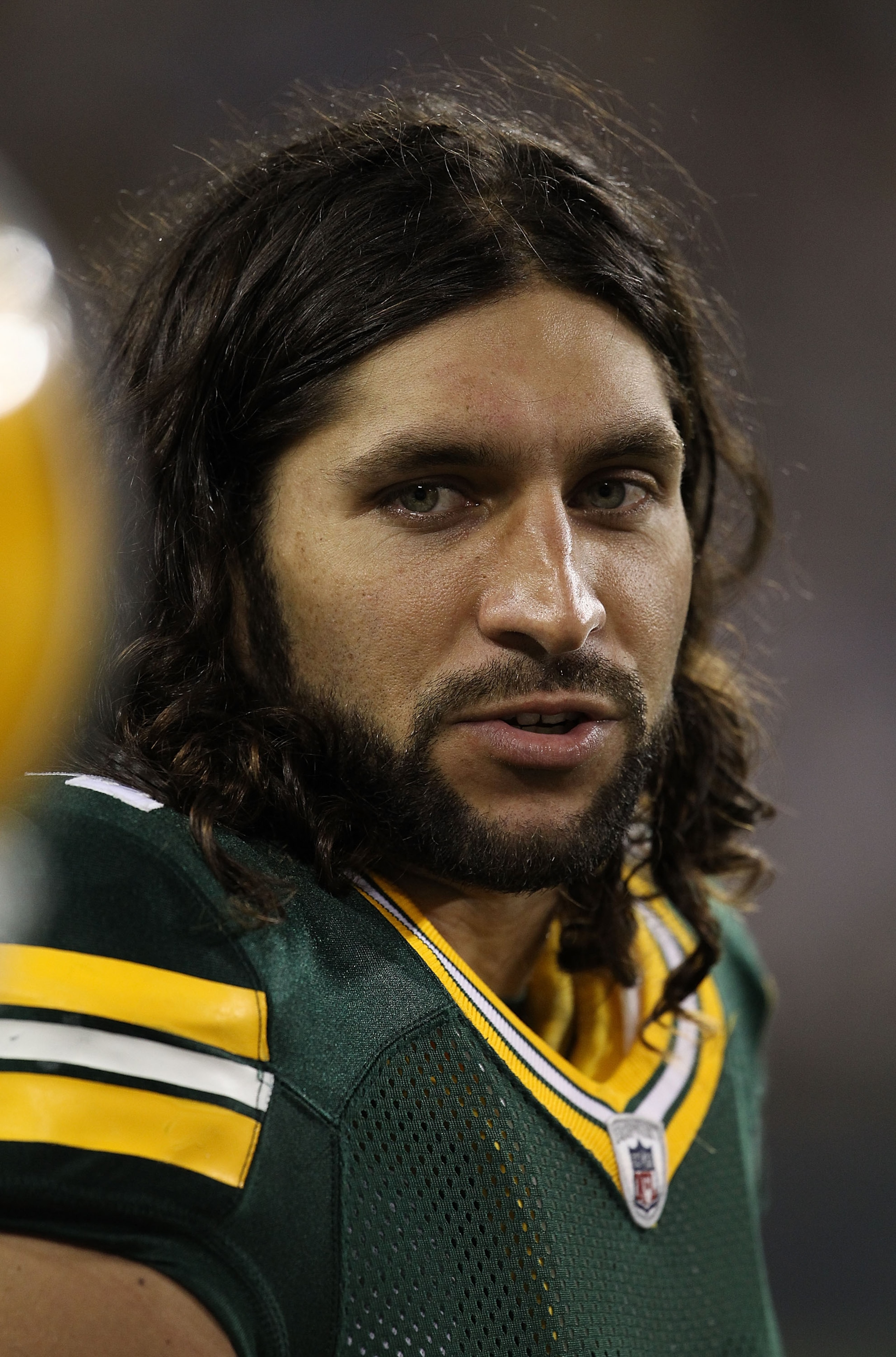 GREEN BAY, WI - AUGUST 26: Brandon Chillar #54 of the Green Bay Packers talks to teammate on the sidelines as his team takes on the Indianapolis Colts during a preseason game at Lambeau Field on August 26, 2010 in Green Bay, Wisconsin. The Packers defeate