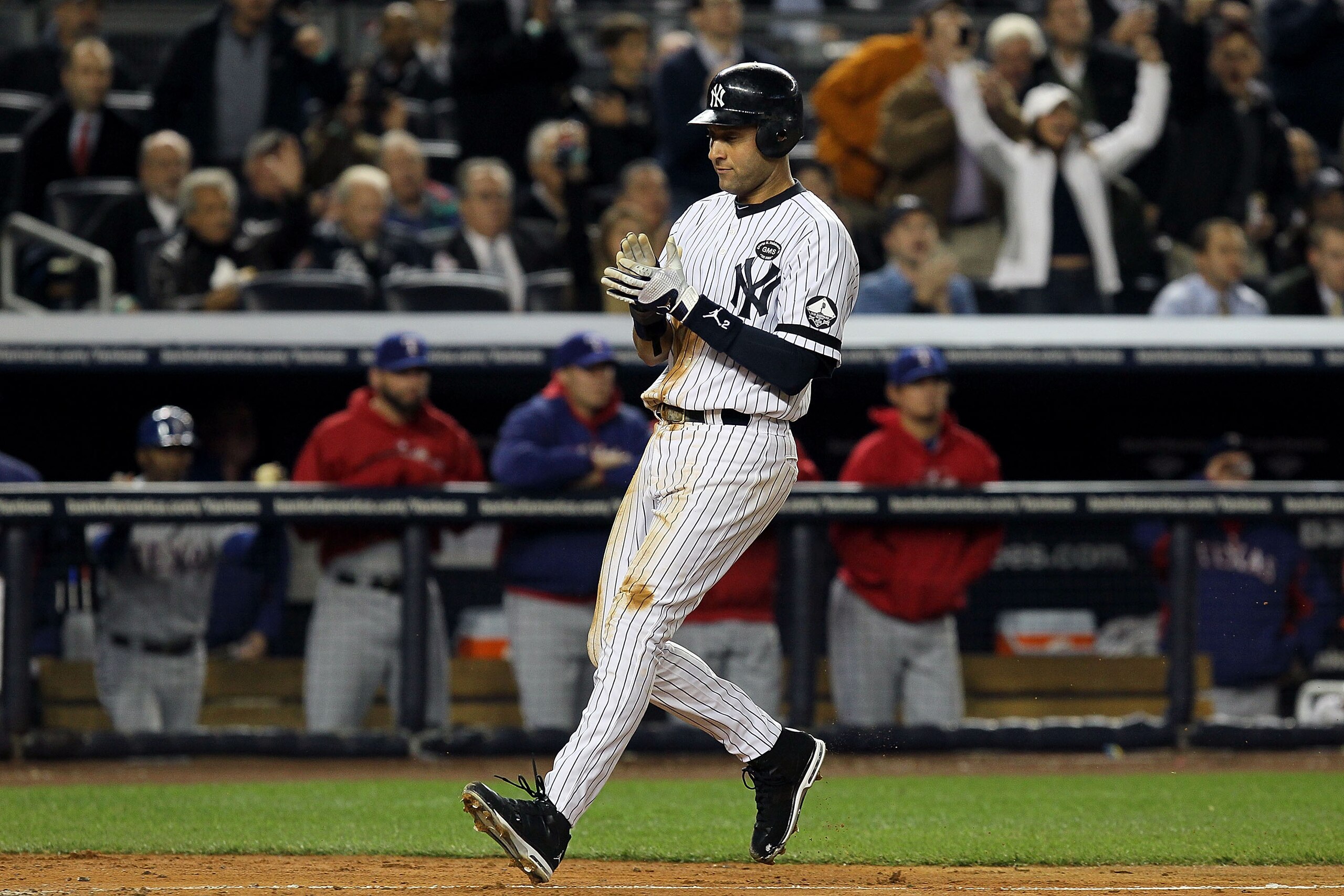NEW YORK - OCTOBER 19:  Derek Jeter #2 of the New York Yankees celebrates after scoring in the third inning against the Texas Rangers in Game Four of the ALCS during the 2010 MLB Playoffs at Yankee Stadium on October 19, 2010 in the Bronx borough of New Y