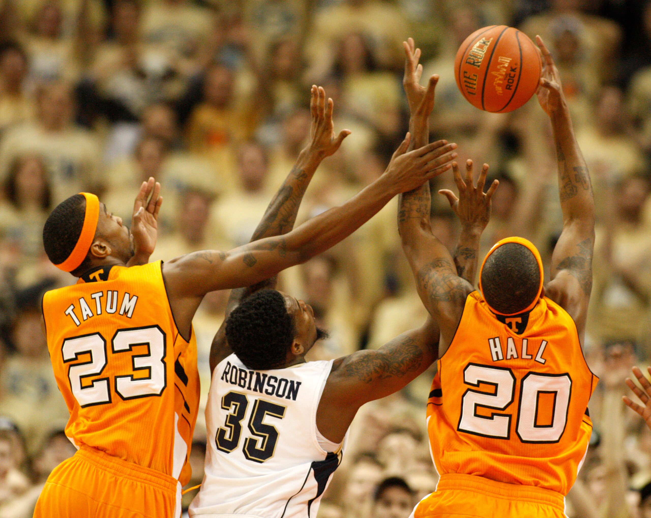 PITTSBURGH, PA - DECEMBER 11:  Cameron Tatum #23 and Kenny Hall #20 of the Tennessee Volunteers battle for a rebound with Nasir Robinson #35 of the Pittsburgh Panthers during the SEC/BIG EAST Invitational at Consol Energy Center on December 11, 2010 in Pi