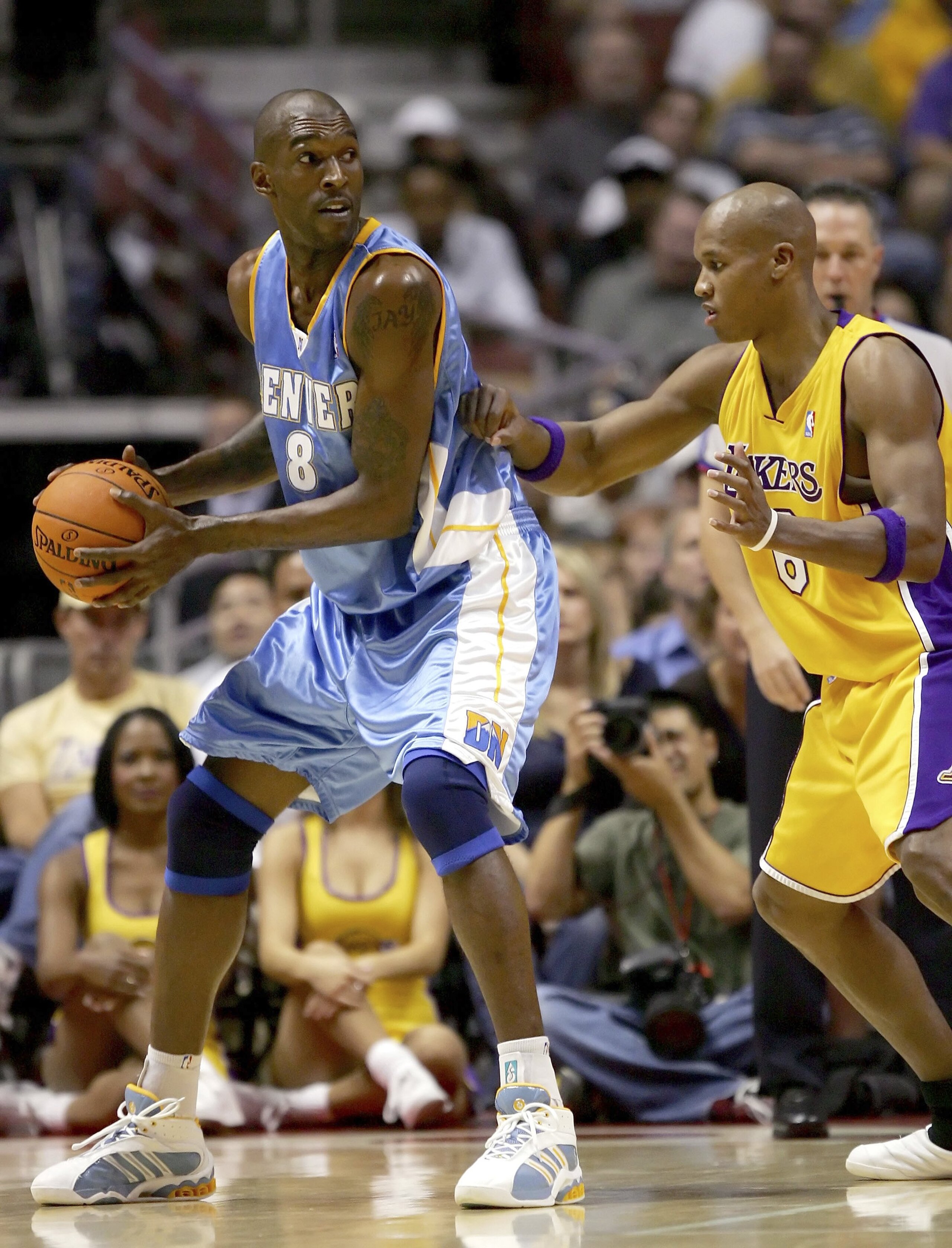 ANAHEIM, CA - OCTOBER 26:   Joe Smith #8 of the Denver Nuggets looks to pass against Maurice Evans #6 of the Los Angeles Lakers during their preseason game on October 26, 2006 at the Honda Center in Anaheim, California. NOTE TO USER: User expressly acknow