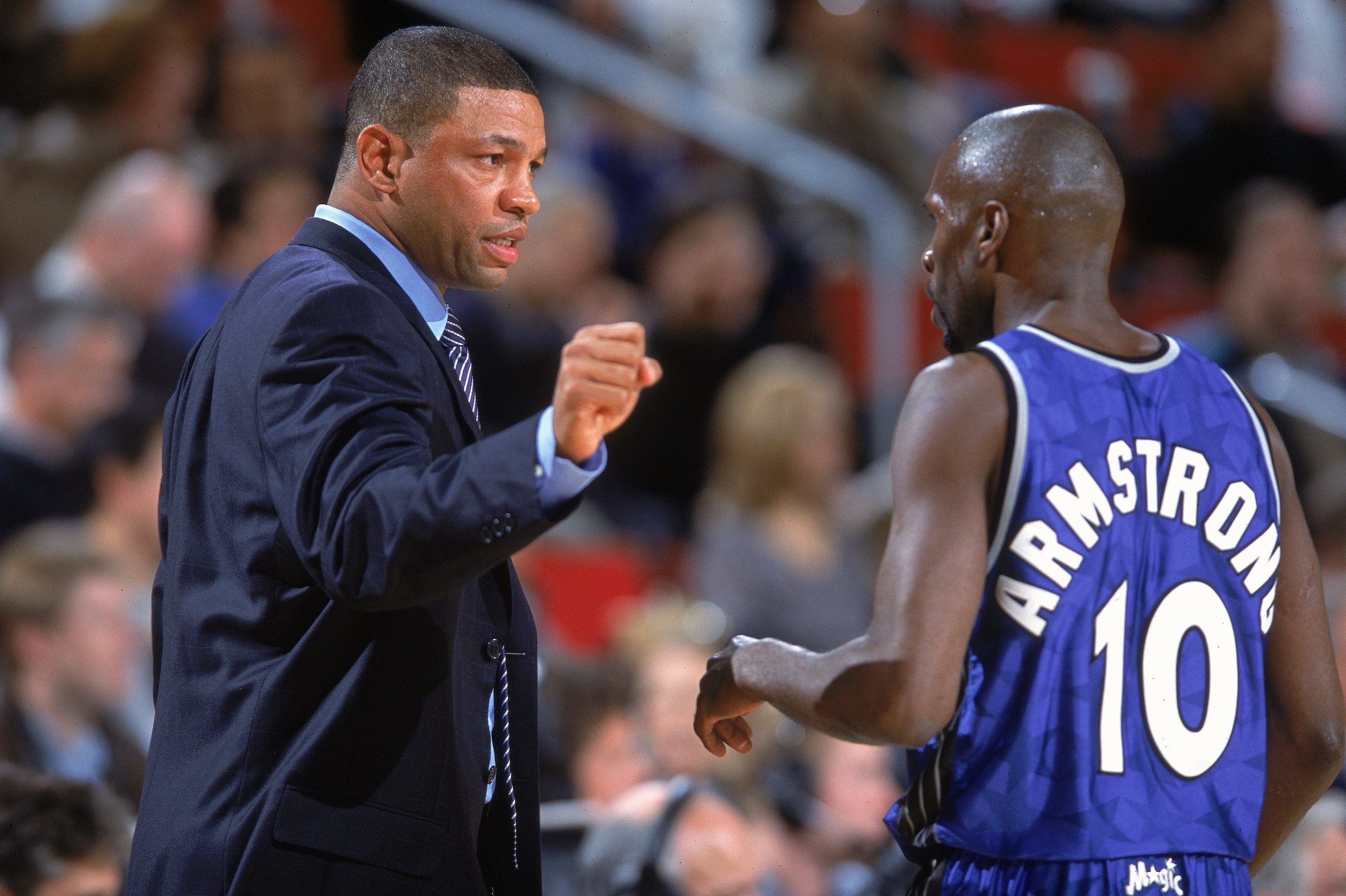 12 Dec 2000:  Head Coach ''Doc'' Rivers of the Orlando Magic talks with player Darrell Armstrong #10 at the sidelines during the game against the Seattle SuperSonics at the Key Arena in Seattle, Washington.  The SuperSonics defeated the Magic 97-92.    NO