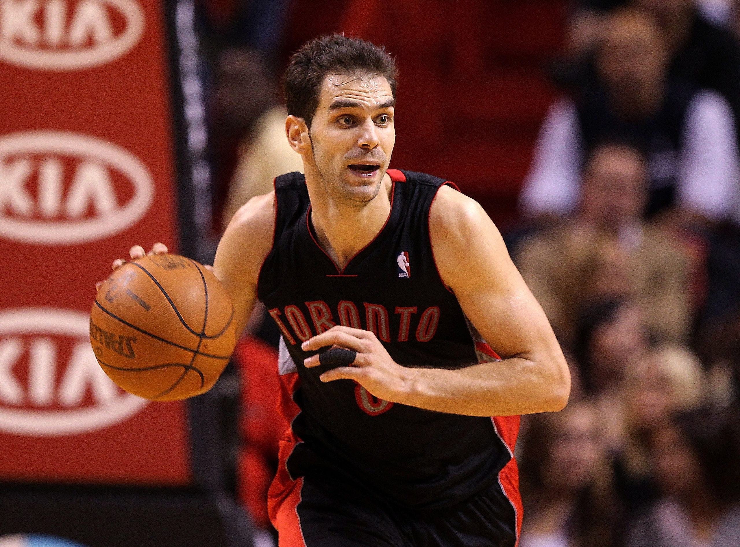 MIAMI, FL - JANUARY 22:  Jose Calderon #8 of the Toronto Raptors dribbles the ball during a game against the Miami Heat at American Airlines Arena on January 22, 2011 in Miami, Florida. NOTE TO USER: User expressly acknowledges and agrees that, by downloa