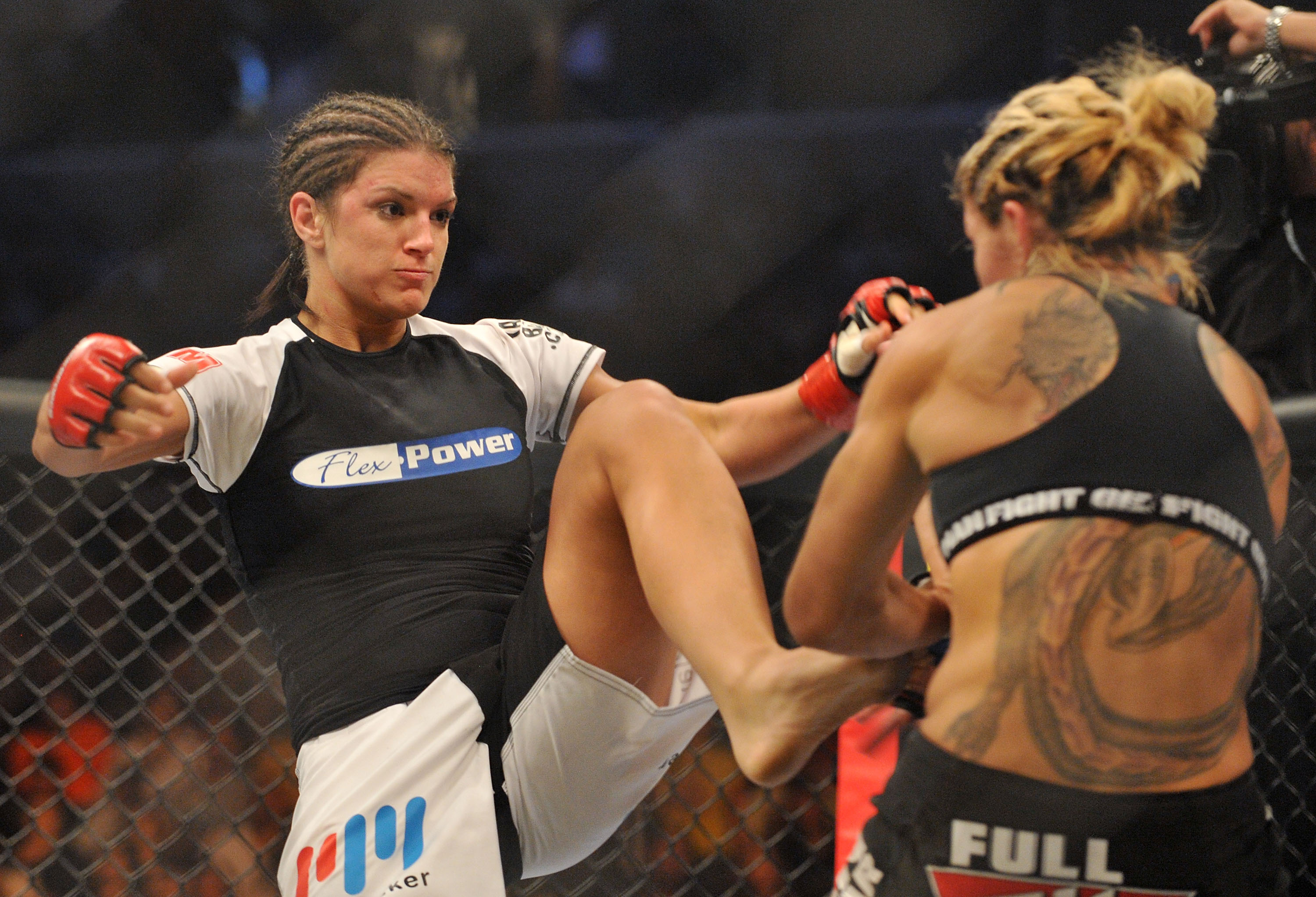 SAN JOSE, CA - AUGUST 15:  Cris Cyborg (R) battles Gina Carano during their Middleweight Championship fight at Stikeforce: Carano vs. Cyborg on August 15, 2009 in San Jose, California.  (Photo by Jon Kopaloff/Getty Images)