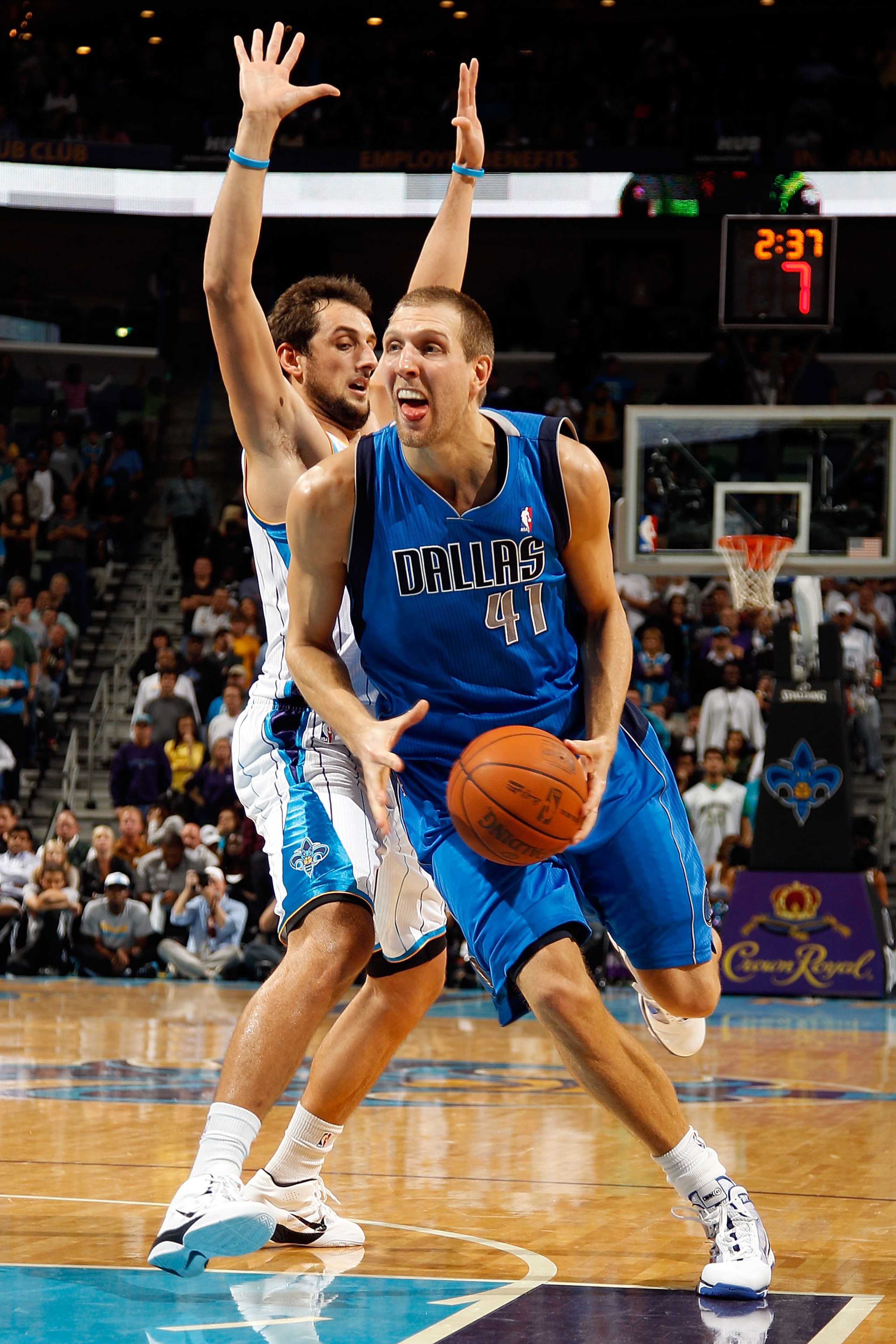 NEW ORLEANS - NOVEMBER 17:  Dirk Nowitzki #41 of the Dallas Mavericks drives the ball around Marco Belinelli #8 of the New Orleans Hornets at the New Orleans Arena on November 17, 2010 in New Orleans, Louisiana.  The Hornets defeated the Mavericks 99-97.