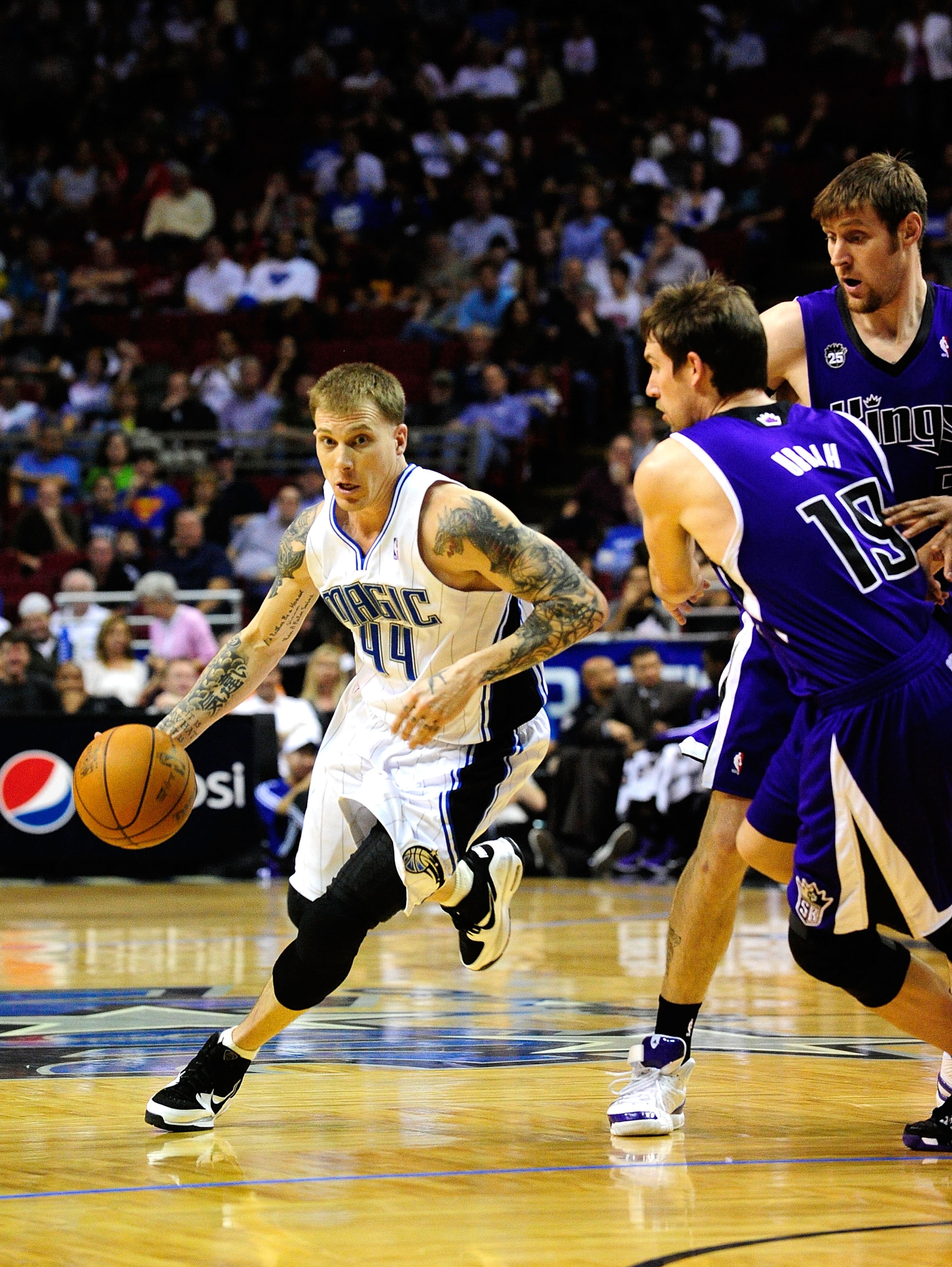 ORLANDO, FL - JANUARY 22:  Jason Williams #44 of the Orlando Magic attempts to drive past Beno Udrih #19 of the Sacramento Kings during the game at Amway Arena on January 22, 2010 in Orlando, Florida. NOTE TO USER: User expressly acknowledges and agrees t