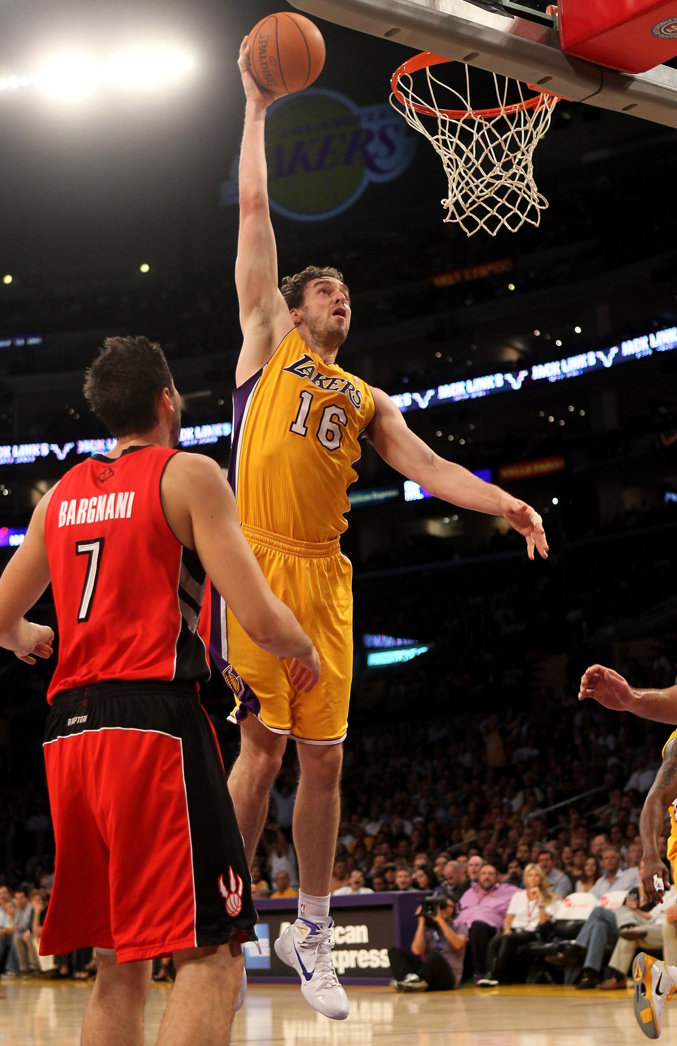 LOS ANGELES, CA - NOVEMBER 05: Pau Gasol #16 of the Los Angeles Lakers shoots over Andrea Bargnani #7 of the Toronto Raptors at Staples Center on November 5, 2010 in Los Angeles, California.   NOTE TO USER: User expressly acknowledges and agrees that, by