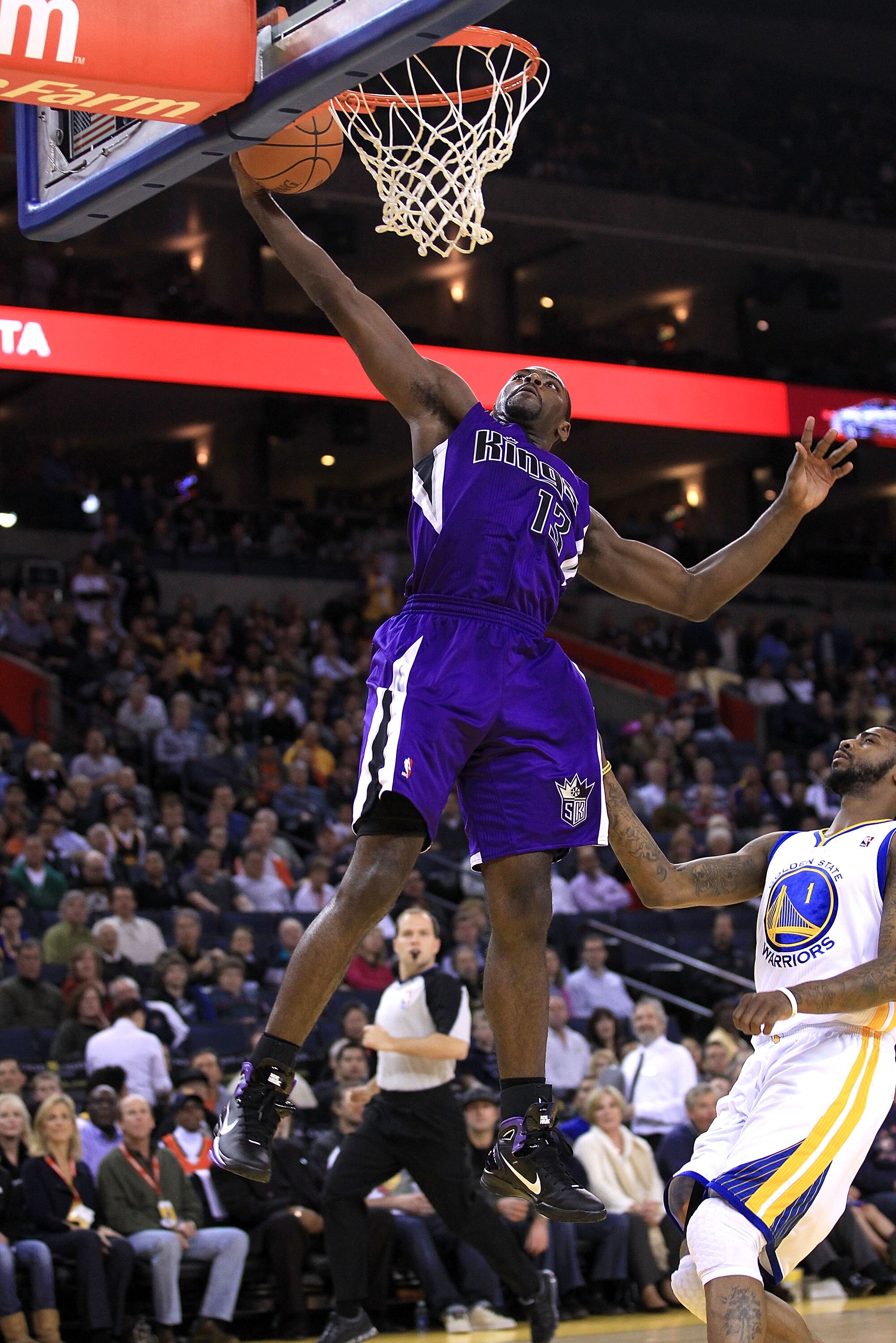 OAKLAND, CA - JANUARY 21:  Tyreke Evans #13 of the Sacramento Kings goes up for a shot over Dorell Wright #1 of the Golden State Warriors at Oracle Arena on January 21, 2011 in Oakland, California. NOTE TO USER: User expressly acknowledges and agrees that