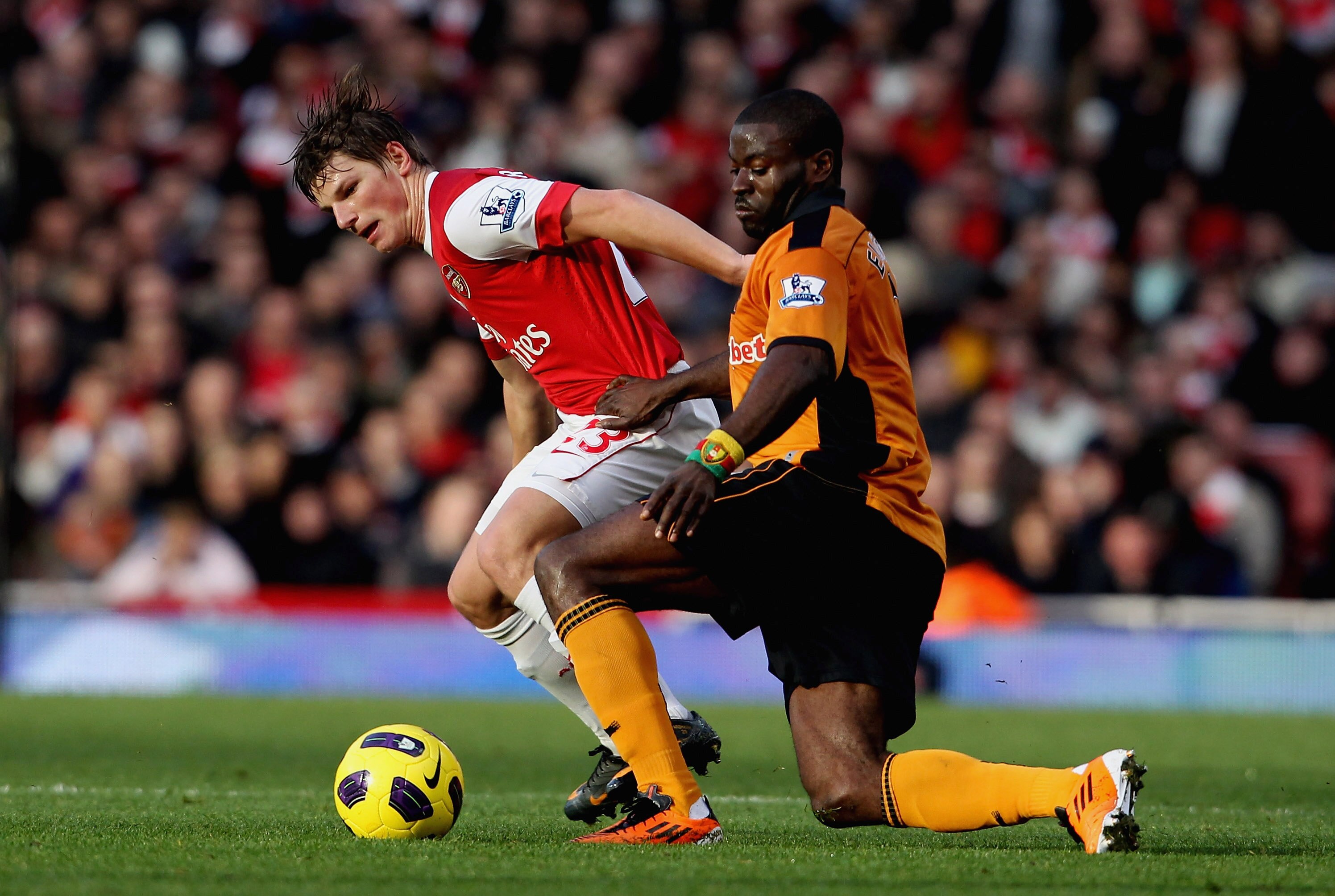 LONDON, ENGLAND - FEBRUARY 12:  Andrey Arshavin of Arsenal in action with George Elokobi of Wolves (L) during the Barclays Premier League match between Arsenal and Wolverhampton Wanderers on February 12, 2011 in London, England.  (Photo by Scott Heavey/Ge