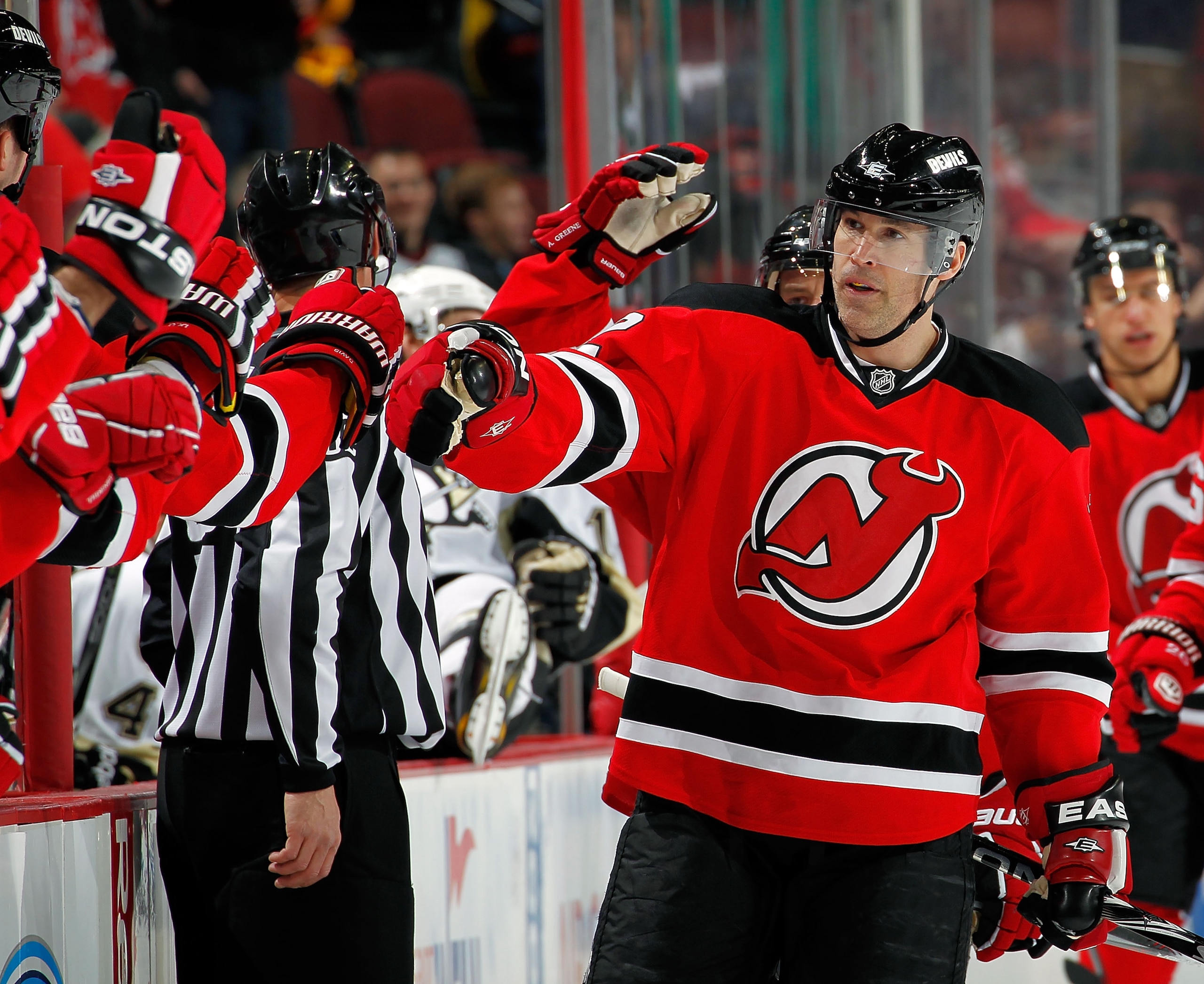 NEWARK, NJ - JANUARY 20:  Brian Rolston #12 of the New Jersey Devils celebrates a goal by Palmieri in the first period of an NHL hockey game against the Pittsburgh Penguins at the Prudential Center on January 20, 2011 in Newark, New Jersey.  (Photo by Pau