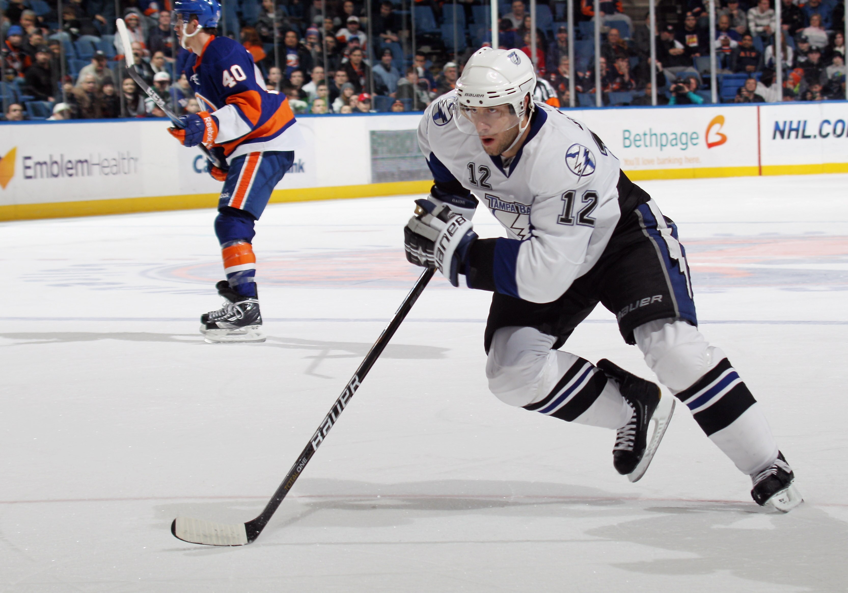 UNIONDALE, NY - DECEMBER 22:  Simon Gagne #12 of the Tampa Bay Lightning skates against the New York Islanders at the Nassau Coliseum on December 22, 2010 in Uniondale, New York.  (Photo by Bruce Bennett/Getty Images)