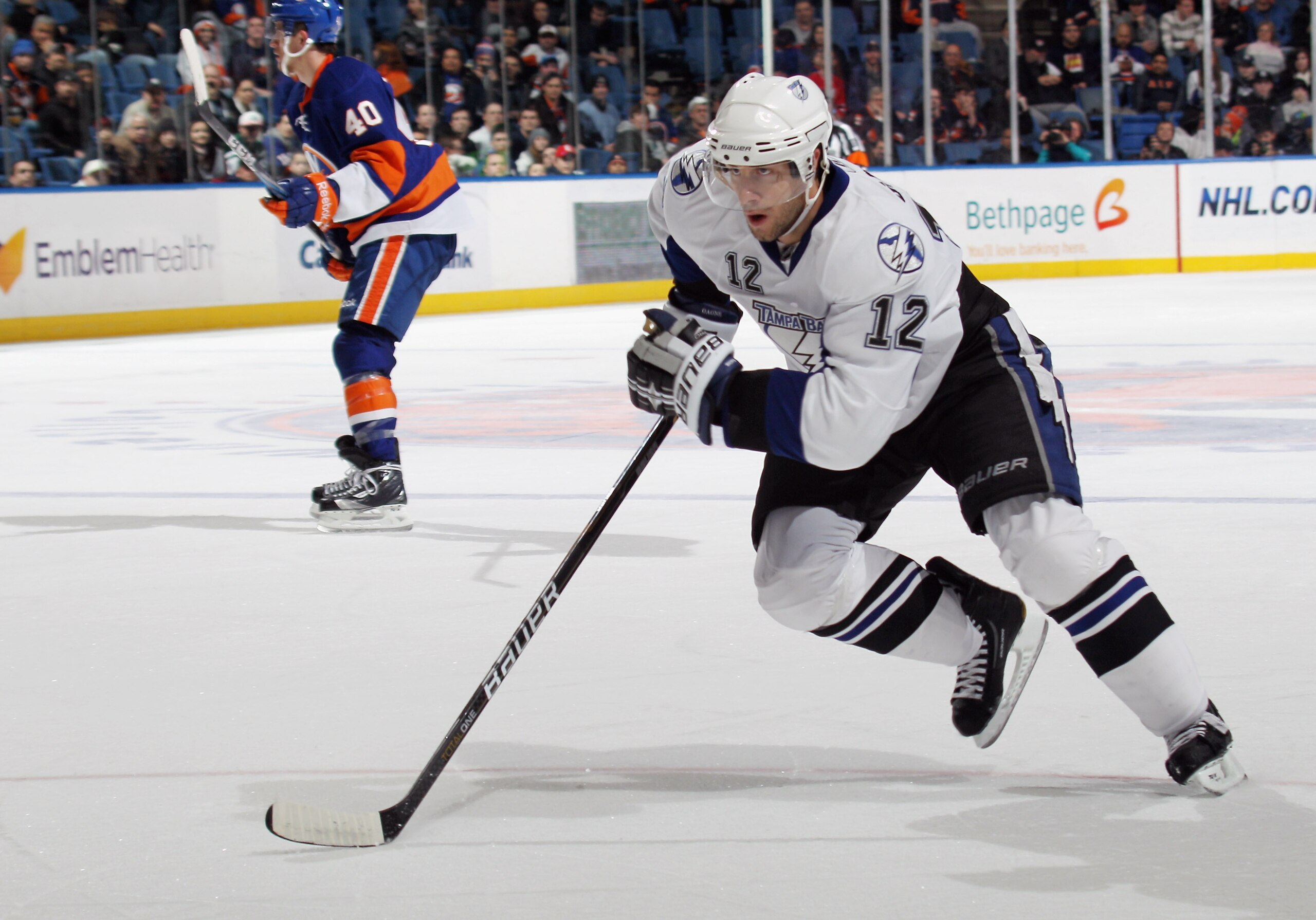 UNIONDALE, NY - DECEMBER 22:  Simon Gagne #12 of the Tampa Bay Lightning skates against the New York Islanders at the Nassau Coliseum on December 22, 2010 in Uniondale, New York.  (Photo by Bruce Bennett/Getty Images)