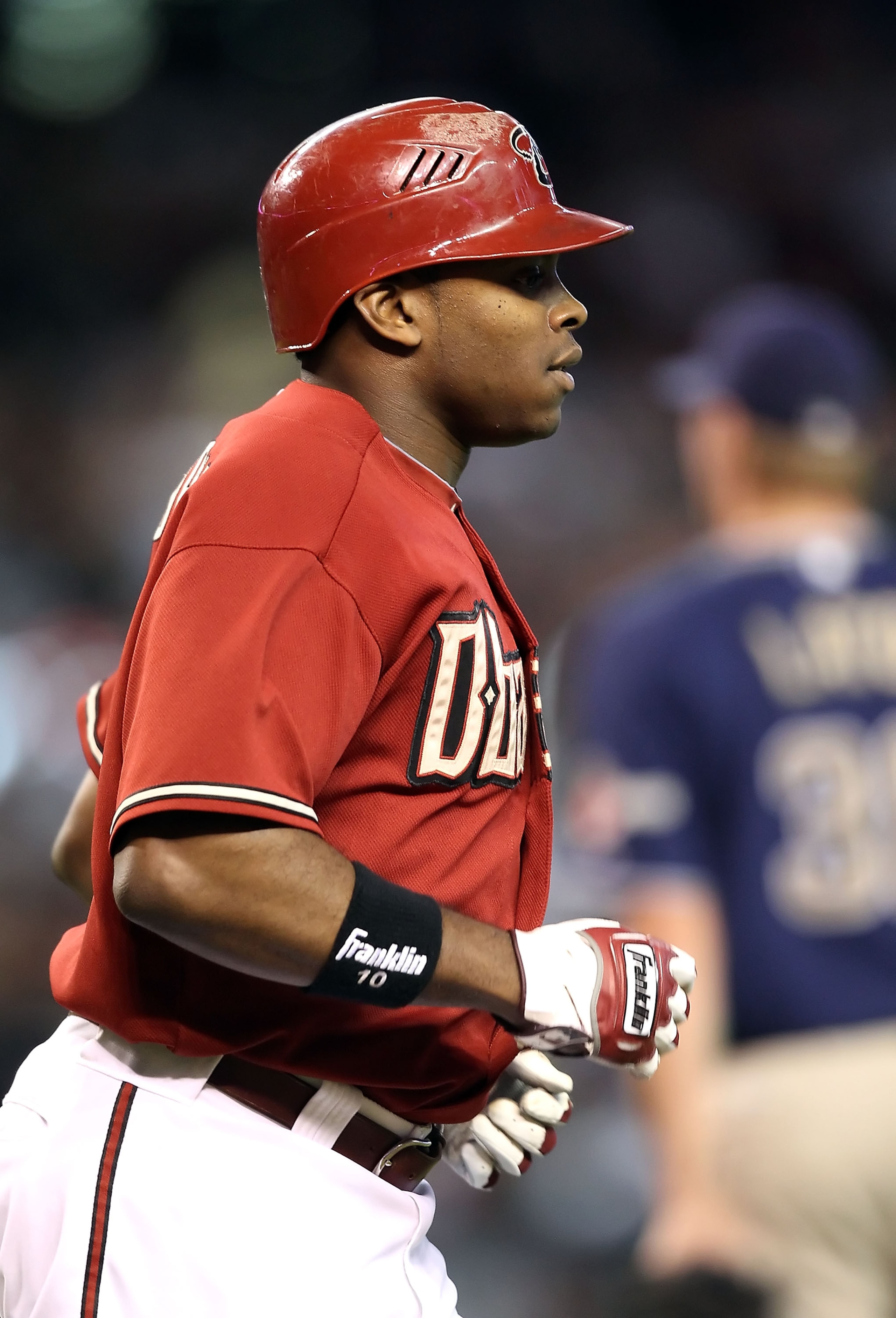 PHOENIX - AUGUST 08:  Justin Upton #10 of the Arizona Diamondbacks runs to first base during the Major League Baseball game against the San Diego Padres at Chase Field on August 8, 2010 in Phoenix, Arizona.  (Photo by Christian Petersen/Getty Images)