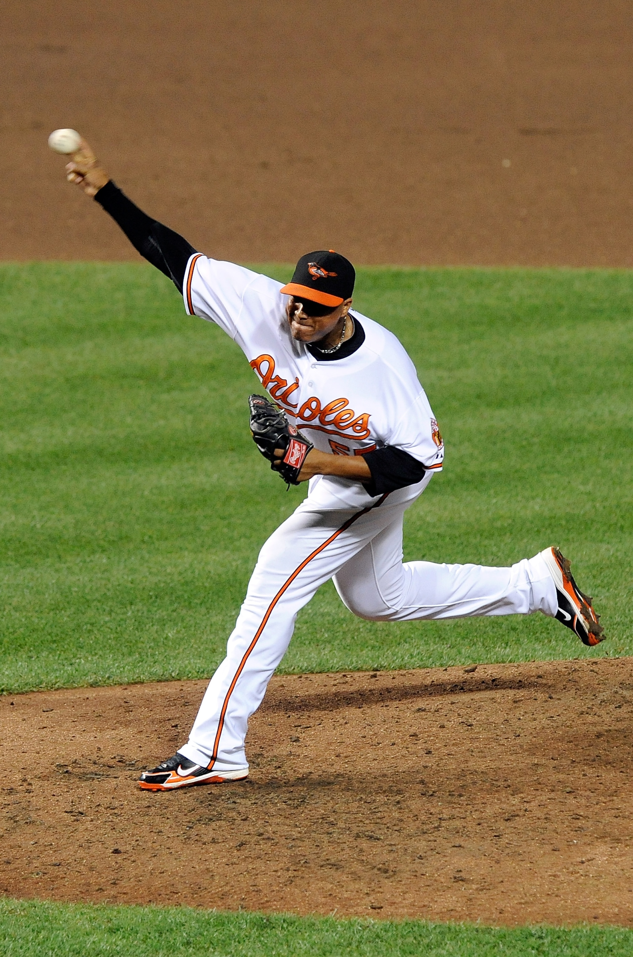 BALTIMORE - AUGUST 04:  Alfredo Simon #55 of the Baltimore Orioles pitches against the Los Angeles Angels of Anaheim at Camden Yards on August 4, 2010 in Baltimore, Maryland.  (Photo by Greg Fiume/Getty Images)