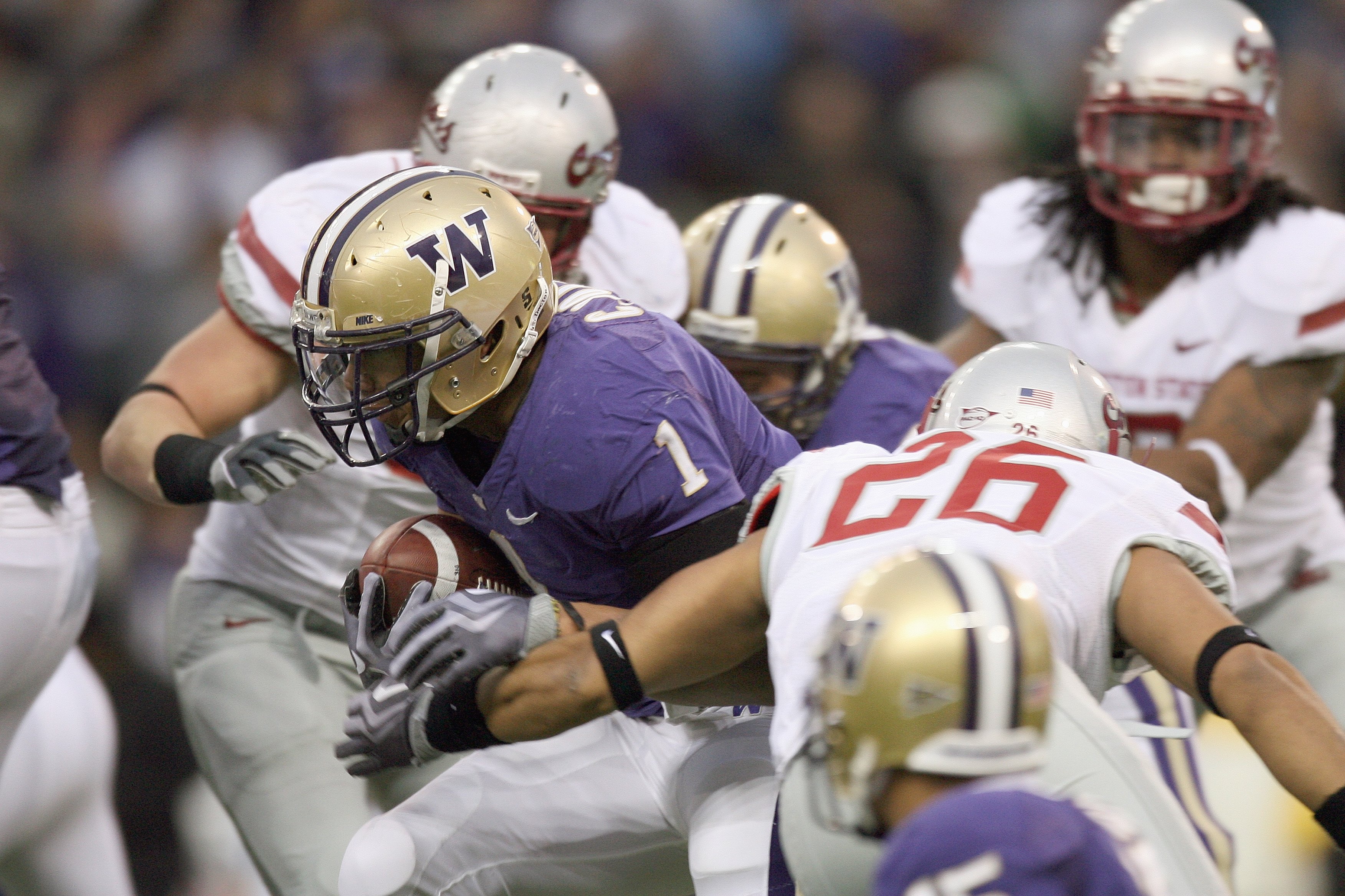 SEATTLE - NOVEMBER 28: Chris Polk #1 of the Washington Huskies carries the ball during the Apple Cup game against the Washington State Cougars on November 28, 2009 at Husky Stadium in Seattle, Washington. The Huskies defeated the Cougars 30-0. (Photo by O
