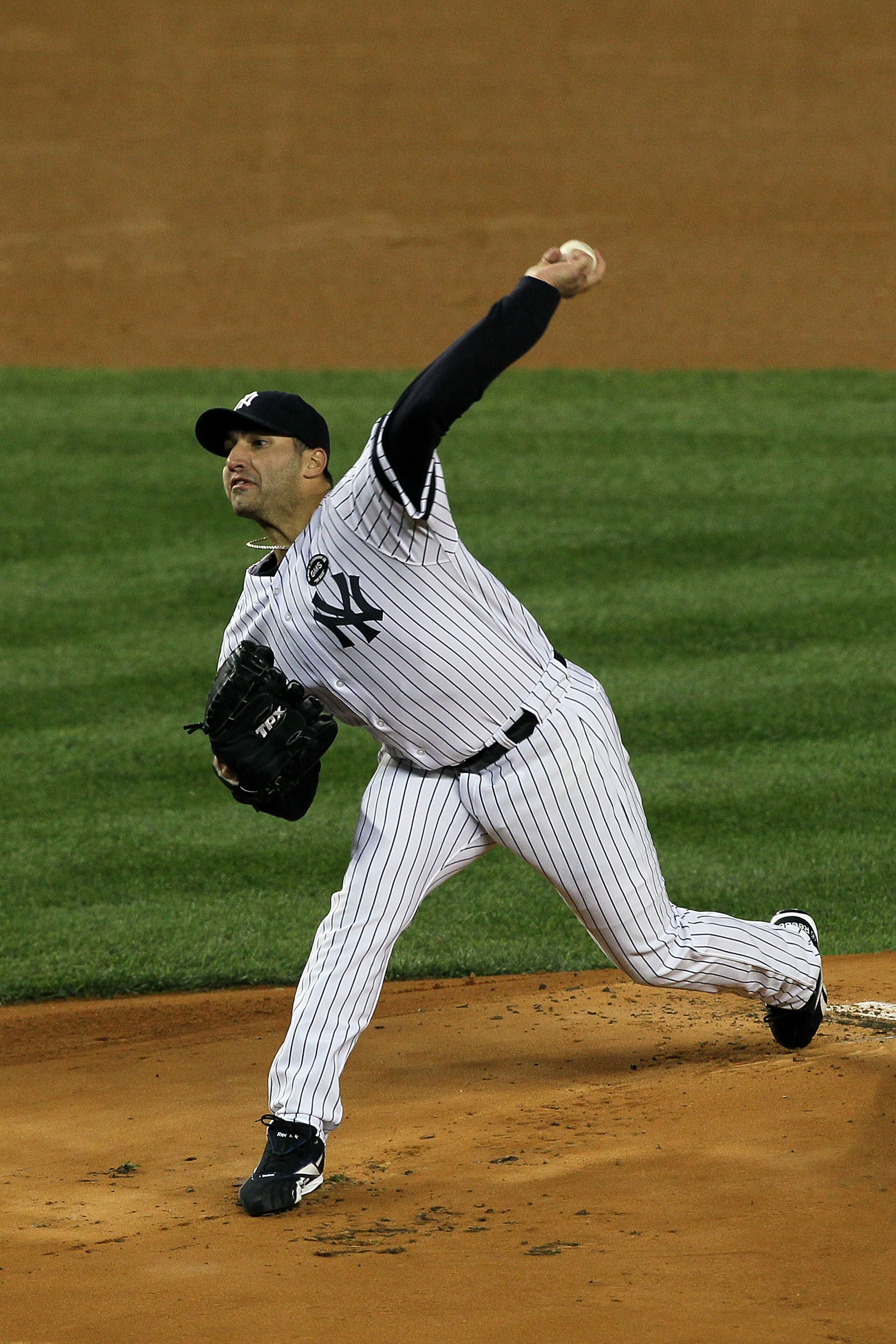NEW YORK - OCTOBER 18:  Starting pitcher Andy Pettitte #46 of the New York Yankees pitches against the Texas Rangers in Game Three of the ALCS during the 2010 MLB Playoffs at Yankee Stadium on October 18, 2010 in New York, New York. The Raners won 8-0.  (