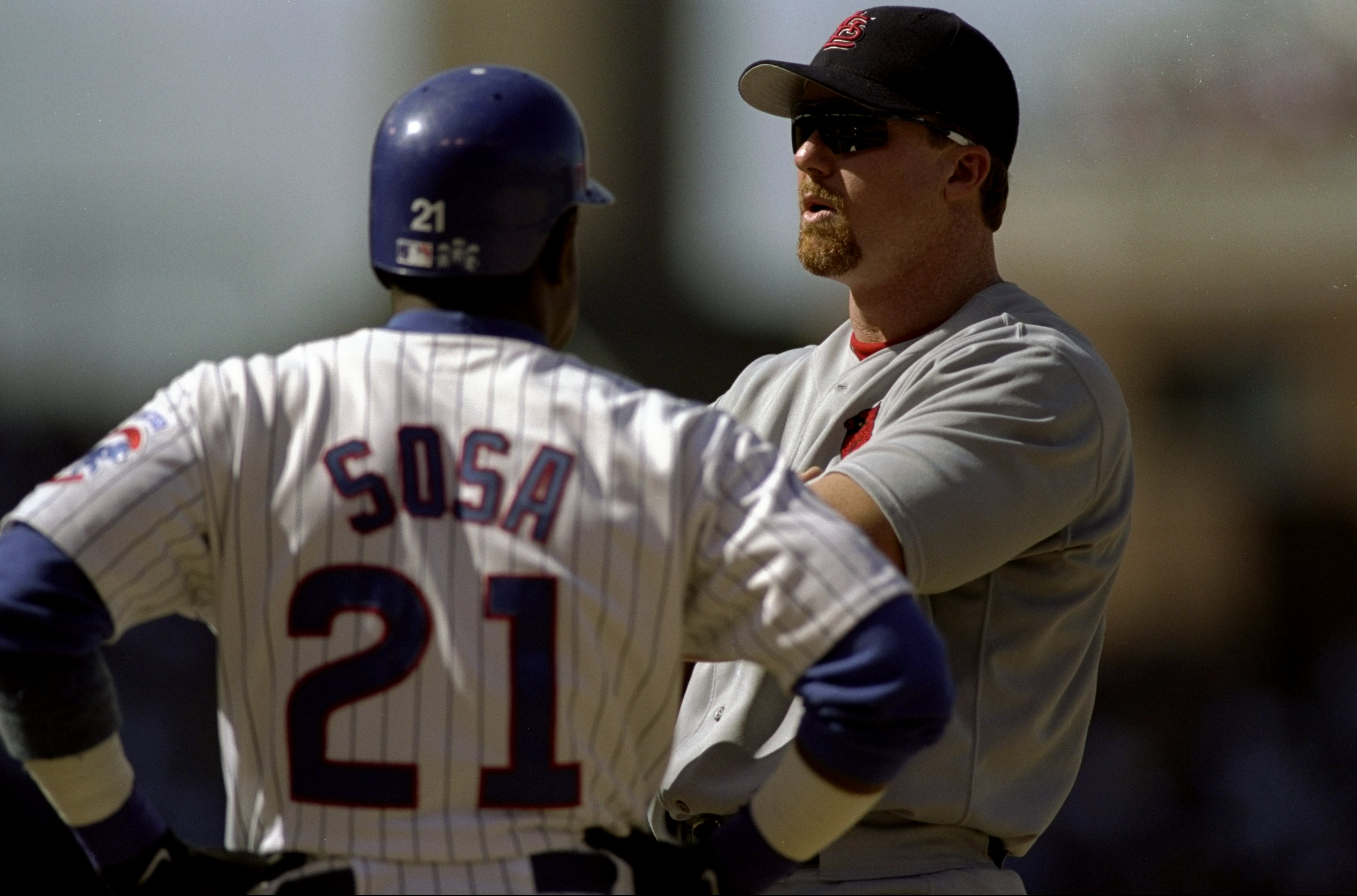 19 Aug 1998:  First-baseman Mark McGwire #25 of the St.Louis Cardinals stands and talks to Sammy Sosa #21 of the Chicago Cubs at Wrigley Field in Chicago,Illinois. The Cardinals defeated the Cubs 8-6.