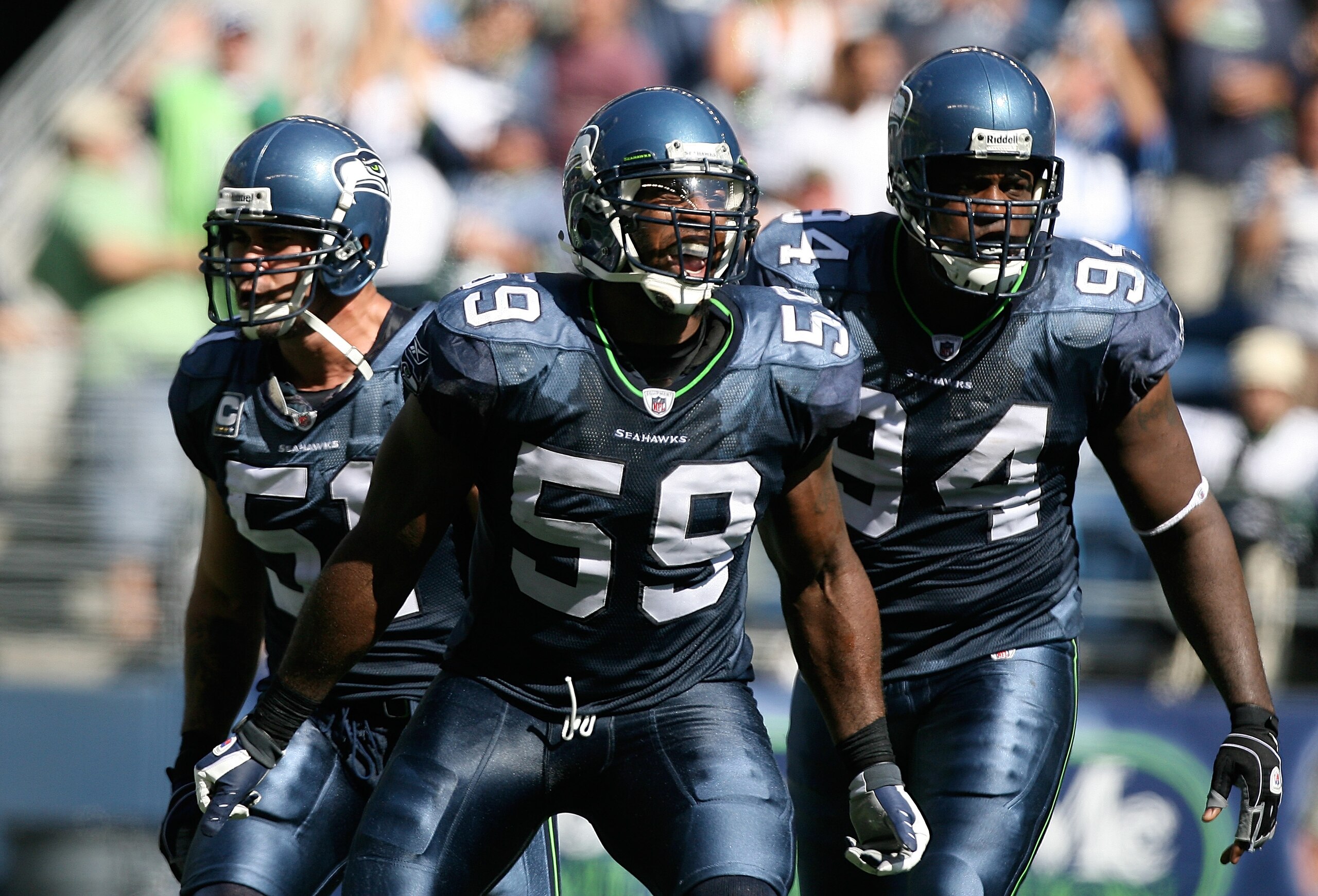 SEATTLE - SEPTEMBER 13: Linebacker Aaron Curry #59 of the Seattle Seahawks, celebrates with teammates Lofa Tatupu #51 and Cory Redding #94 after sacking quarterback Marc Bulger #10 of the St. Louis Rams on September 13, 2009 at Qwest Field in Seattle, Wa SEATTLE - SEPTEMBER 13: Linebacker Aaron Curry #59 of the Seattle Seahawks, celebrates with teammates Lofa Tatupu #51 and Cory Redding #94 after sacking quarterback Marc Bulger #10 of the St. Louis Rams on September 13, 2009 at Qwest Field in Seattle, Wa