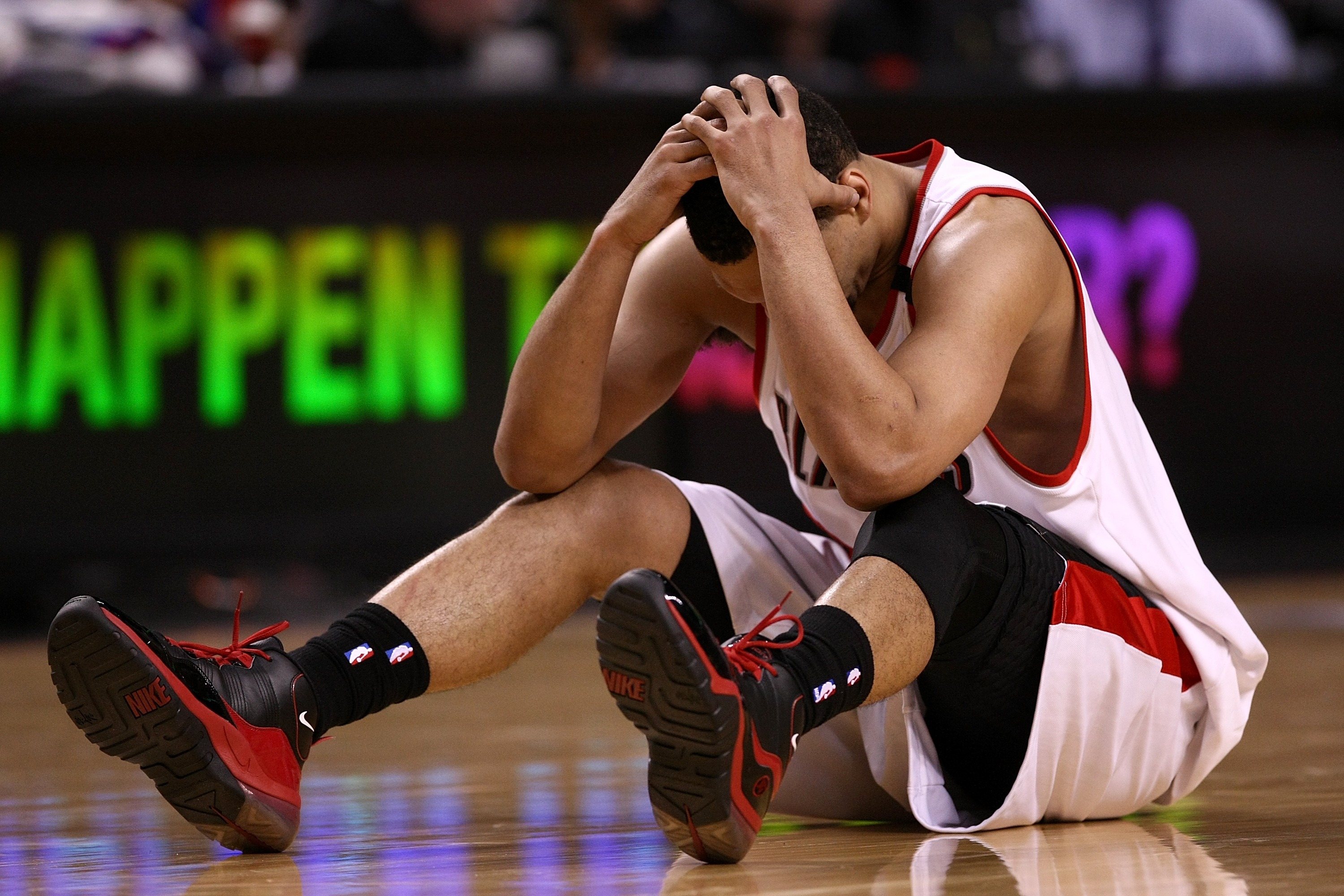 PORTLAND, OR - APRIL 18:  Brandon Roy #7 of the Portland Trail Blazers holds his head after being injured during a scramble for the ball against  the Houston Rockets during Game One of the Western Conference Quarterfinals of the 2009 NBA Playoffs on April
