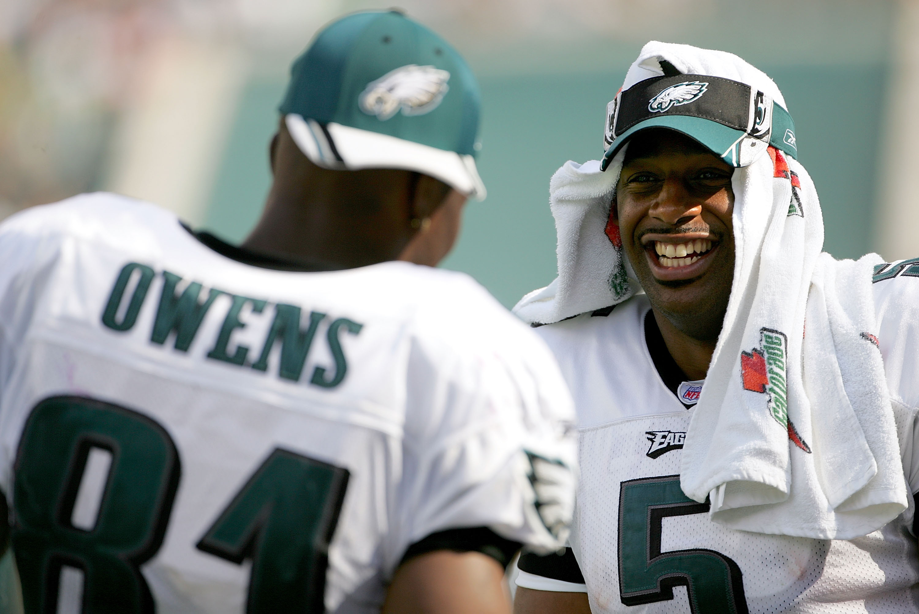 PHILADELPHIA - SEPTEMBER 18:  Quarterback Donovan McNabb #5 of the Philadelphia Eagles jokes with teammate receiver Terrell Owens #81 while on the sidelines during the second half of the game against the San Francisco 49ers on September 18, 2005 at Lincol