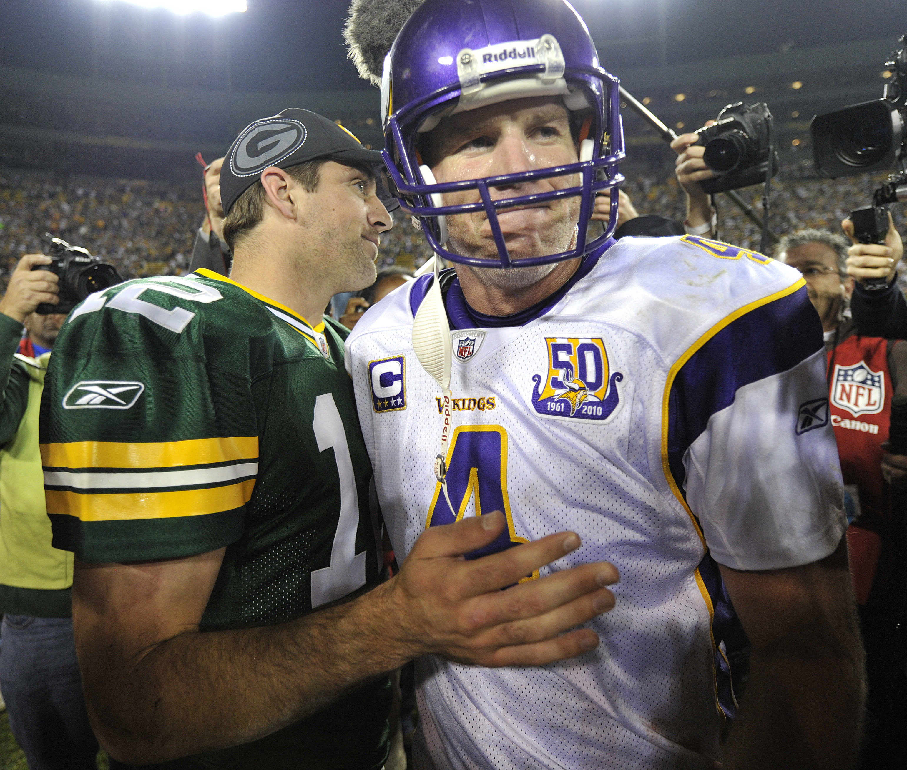 GREEN BAY, WI - OCTOBER 24: Aaron Rodgers #12 of the Green Bay Packers meets with Brett Favre #4 of the Minnesota Vikings after the Packers defeated the Vikings 28-24 at Lambeau Field on October 24, 2010 in Green Bay, Wisconsin. (Photo by Jim Prisching/Ge