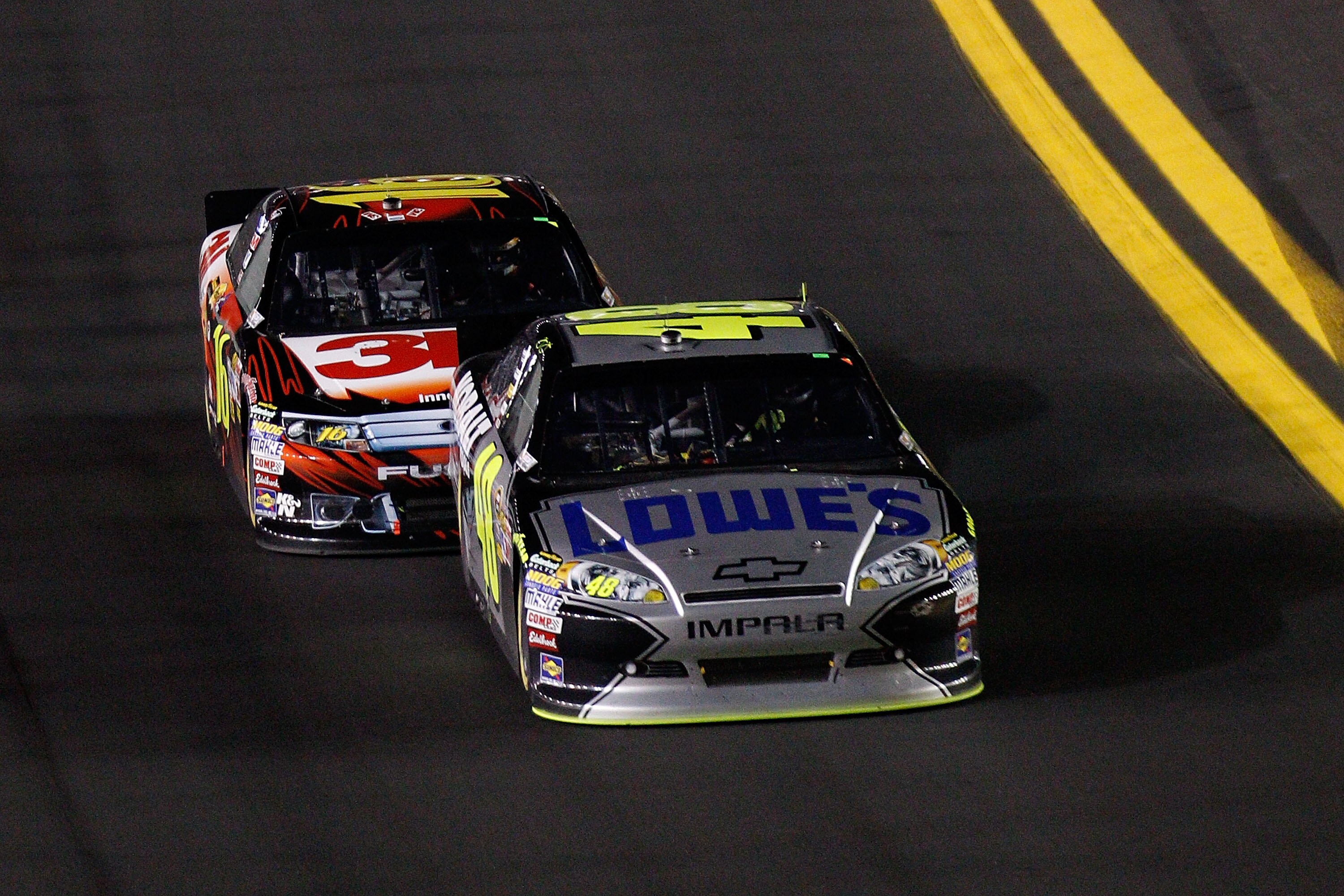DAYTONA BEACH, FL - FEBRUARY 12:  Jimmie Johnson, driver of the #48 Lowe's Chevrolet,  leads Greg Biffle, driver of the #16 3M Ford, during the NASCAR Budweiser Shootout at Daytona International Speedway on February 12, 2011 in Daytona Beach, Florida.  (P