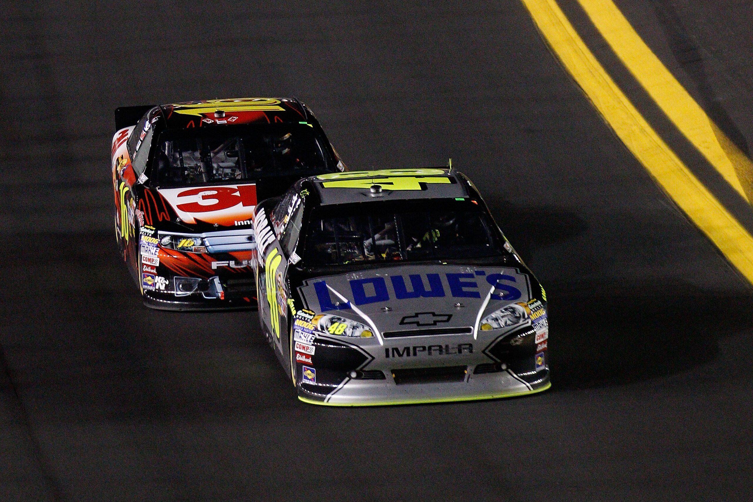 DAYTONA BEACH, FL - FEBRUARY 12:  Jimmie Johnson, driver of the #48 Lowe's Chevrolet,  leads Greg Biffle, driver of the #16 3M Ford, during the NASCAR Budweiser Shootout at Daytona International Speedway on February 12, 2011 in Daytona Beach, Florida.  (P