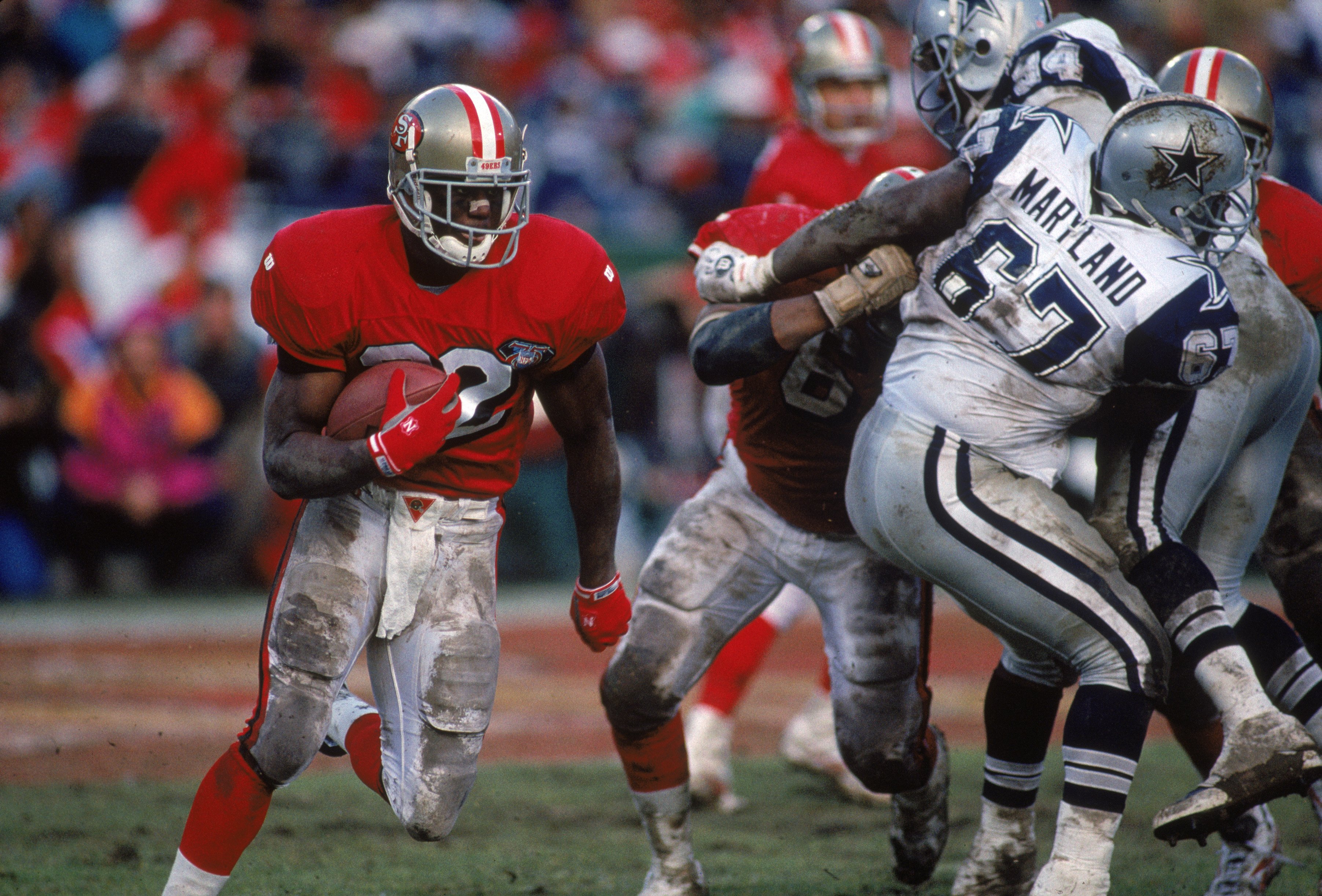 SAN FRANCISCO - JANUARY 15:  Running back Ricky Watters #32 of the San Francisco 49ers runs with the ball during the 1994 NFC Championship game against the Dallas Cowboys at Candlestick Park on January 15, 1995 in San Francisco, California.  The 49ers won