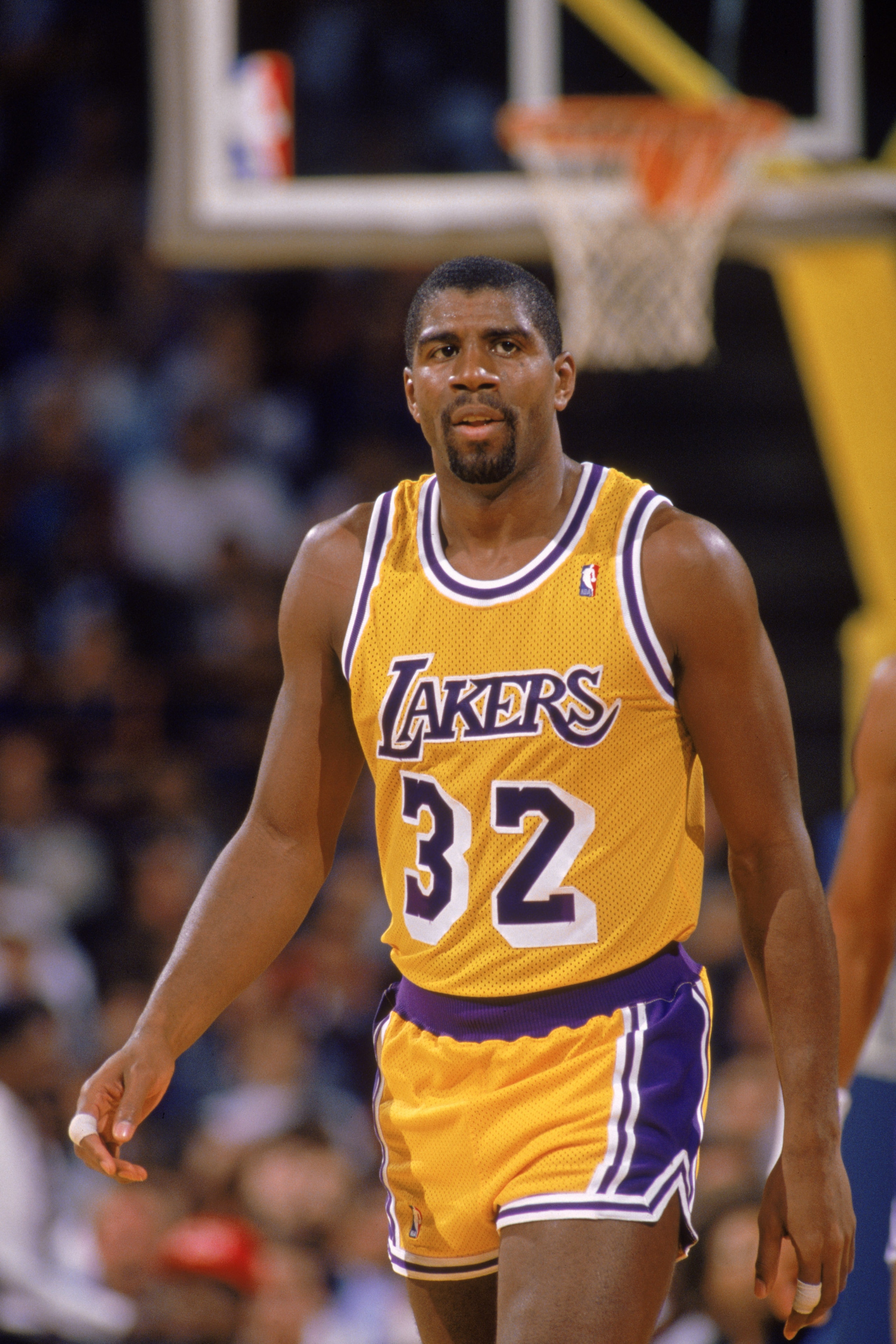 LOS ANGELES - 1988: Magic Johnson #32 of the Los Angeles Lakers walks down the court during an NBA game at the Great Western Forum in Los Angeles, California in 1988. (Photo by: Tim Defrisco/Getty Images) LOS ANGELES - 1988: Magic Johnson #32 of the Los Angeles Lakers walks down the court during an NBA game at the Great Western Forum in Los Angeles, California in 1988. (Photo by: Tim Defrisco/Getty Images)