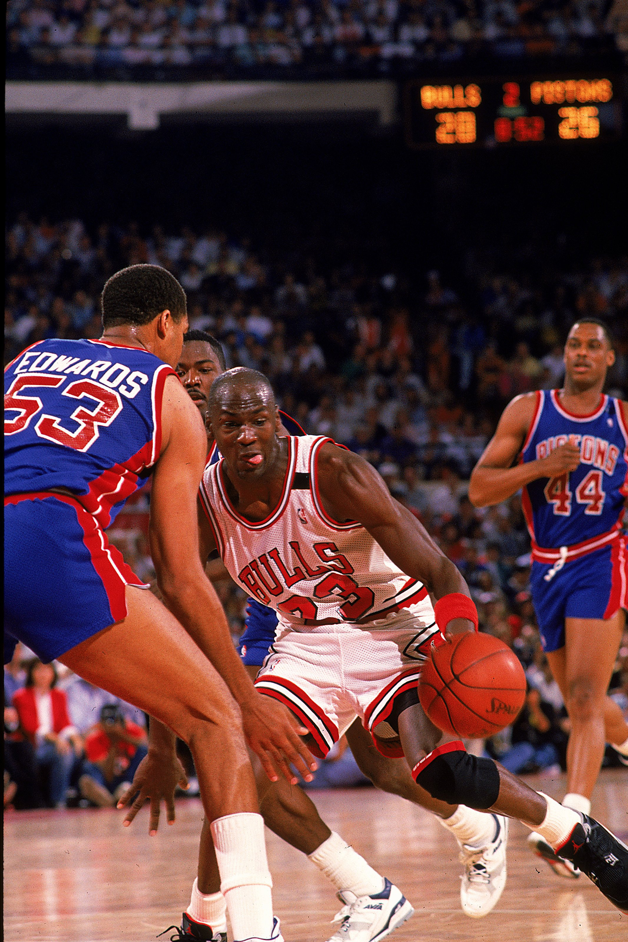 1988:  Michael Jordan #23 of the Chicago Bulls takes the ball to the basket during the game against the Detroit Pistons. NOTE TO USER: It is expressly understood that the only rights Allsport are offering to license in this Photograph are one-time, non-ex