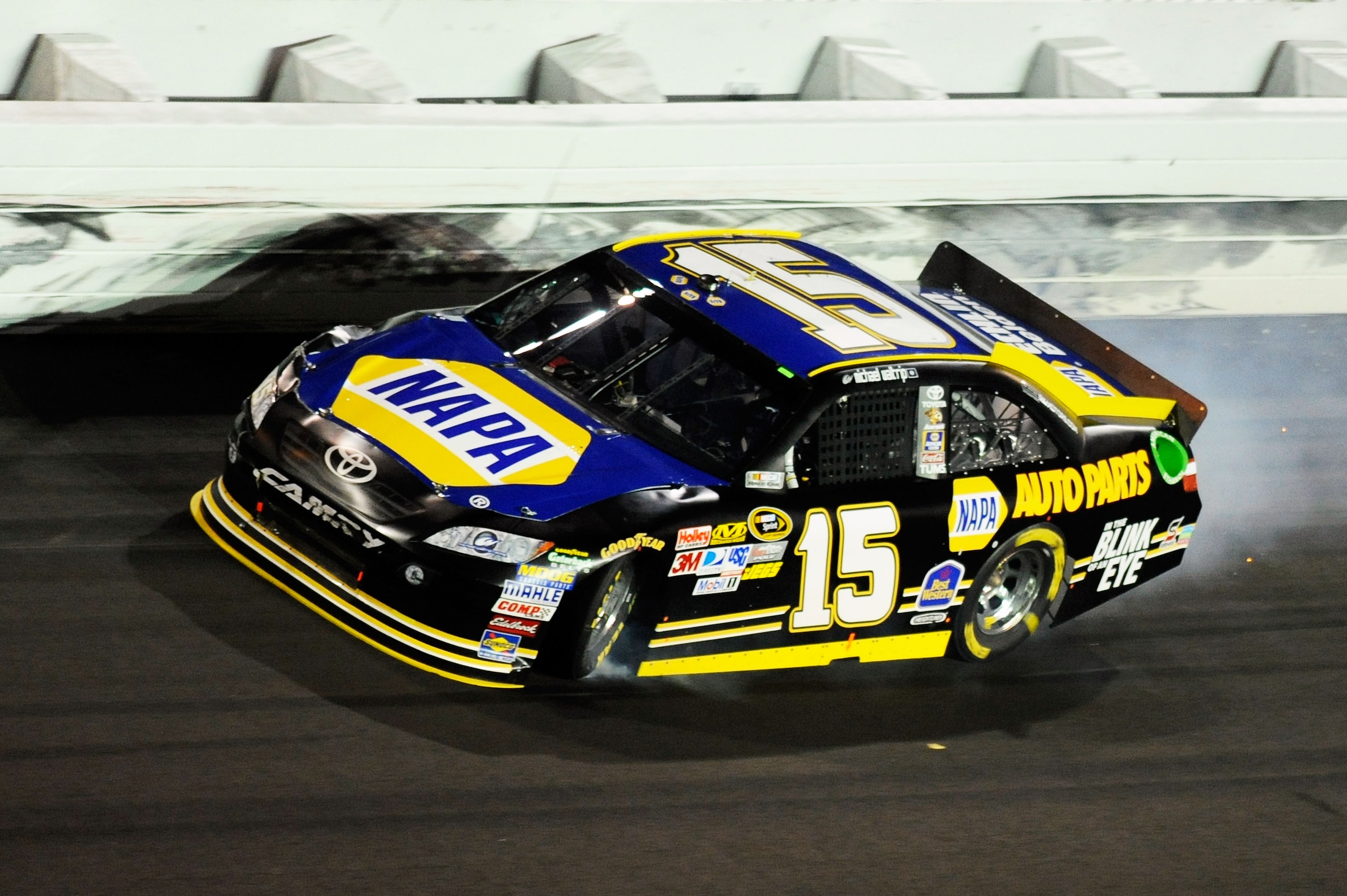 DAYTONA BEACH, FL - FEBRUARY 12:  Michael Waltrip, driver of the #15 NAPA Toyota, spins out of control during the NASCAR Budweiser Shootout at Daytona International Speedway on February 12, 2011 in Daytona Beach, Florida.  (Photo by John Harrelson/Getty I