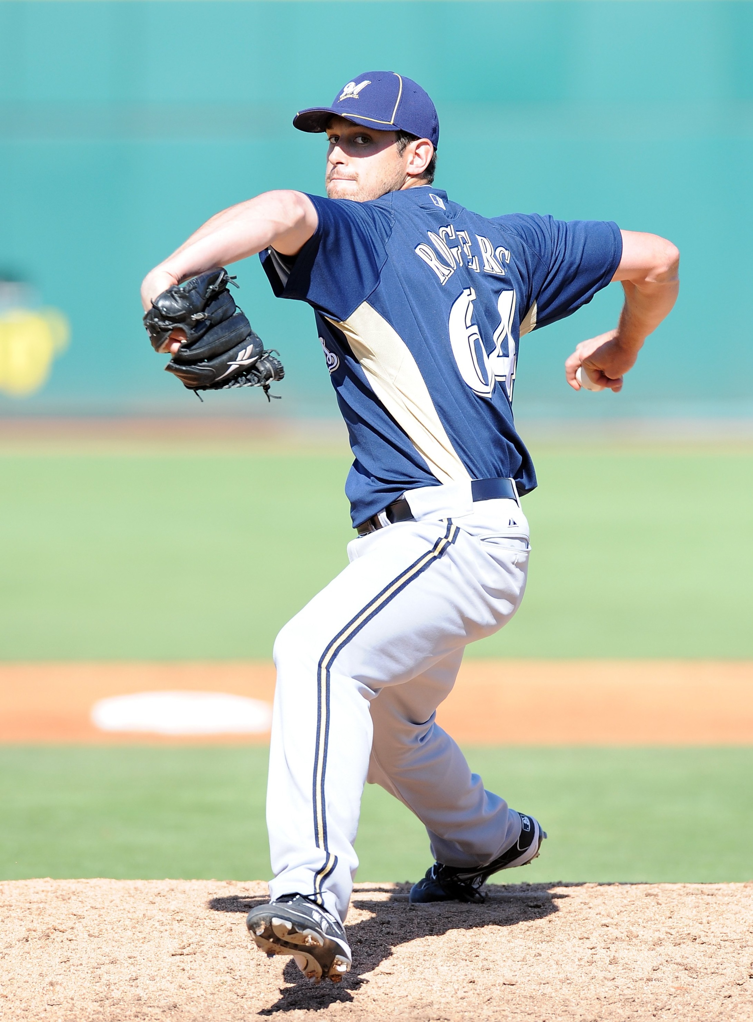 GOODYEAR, AZ - MARCH 11:  Mark Rogers #64 of the Milwaukee Brewers pitches during a Spring Training game against the Cincinnati Reds on March 11, 2010 at Goodyear Ballpark in Goodyear, Arizona.  (Photo by Lisa Blumenfeld/Getty Images)