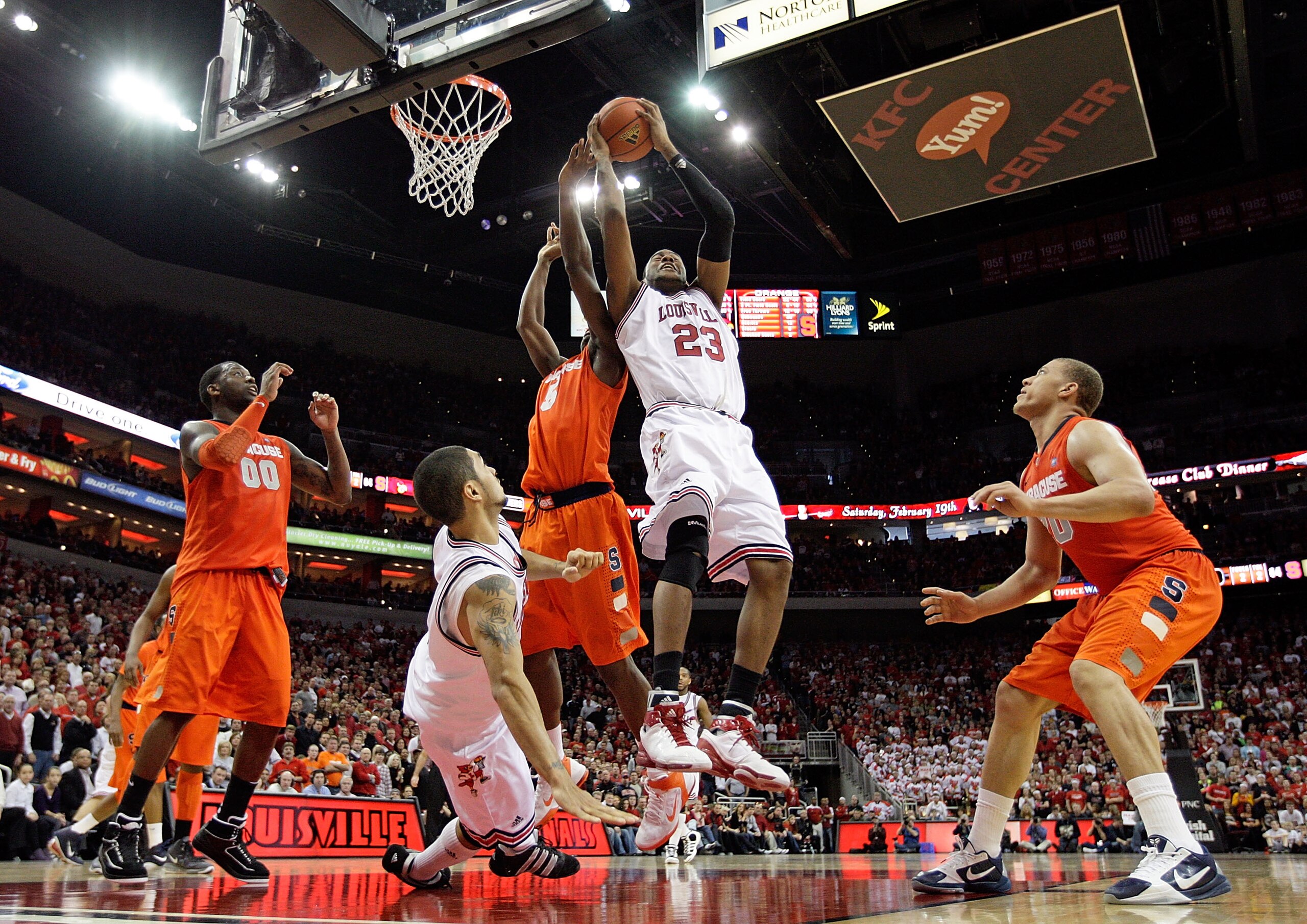 LOUISVILLE, KY - FEBRUARY 12: Terrence Jennings #23 of the Louisville Cardinals reaches for a rebound during the Big East Conference game against the Syracuse Orange at the KFC Yum! Center on February 12, 2011 in Louisville, Kentucky. Louisville won73- LOUISVILLE, KY - FEBRUARY 12: Terrence Jennings #23 of the Louisville Cardinals reaches for a rebound during the Big East Conference game against the Syracuse Orange at the KFC Yum! Center on February 12, 2011 in Louisville, Kentucky. Louisville won73-