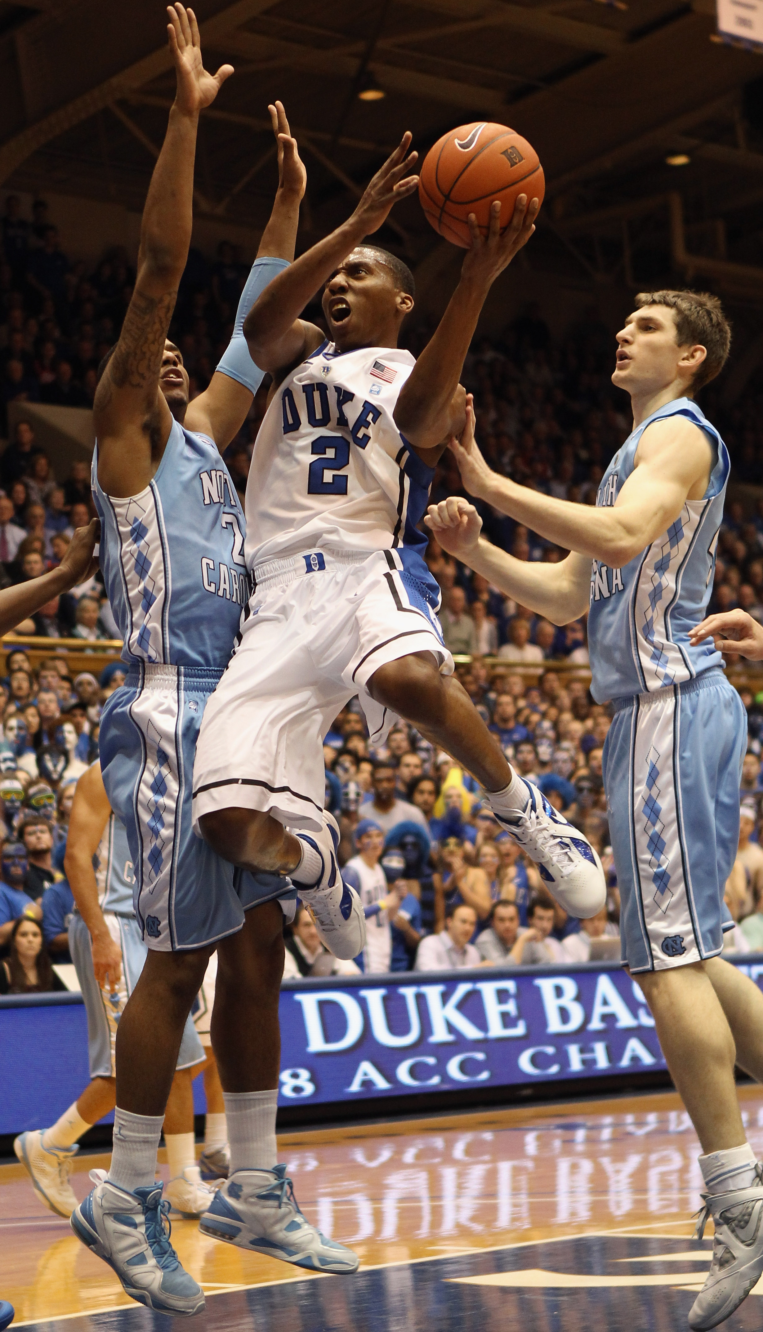 DURHAM, NC - FEBRUARY 09:  Tyler Zeller #44 of the North Carolina Tar Heels tries to stop Nolan Smith #2 of the Duke Blue Devils during their game at Cameron Indoor Stadium on February 9, 2011 in Durham, North Carolina.  (Photo by Streeter Lecka/Getty Ima